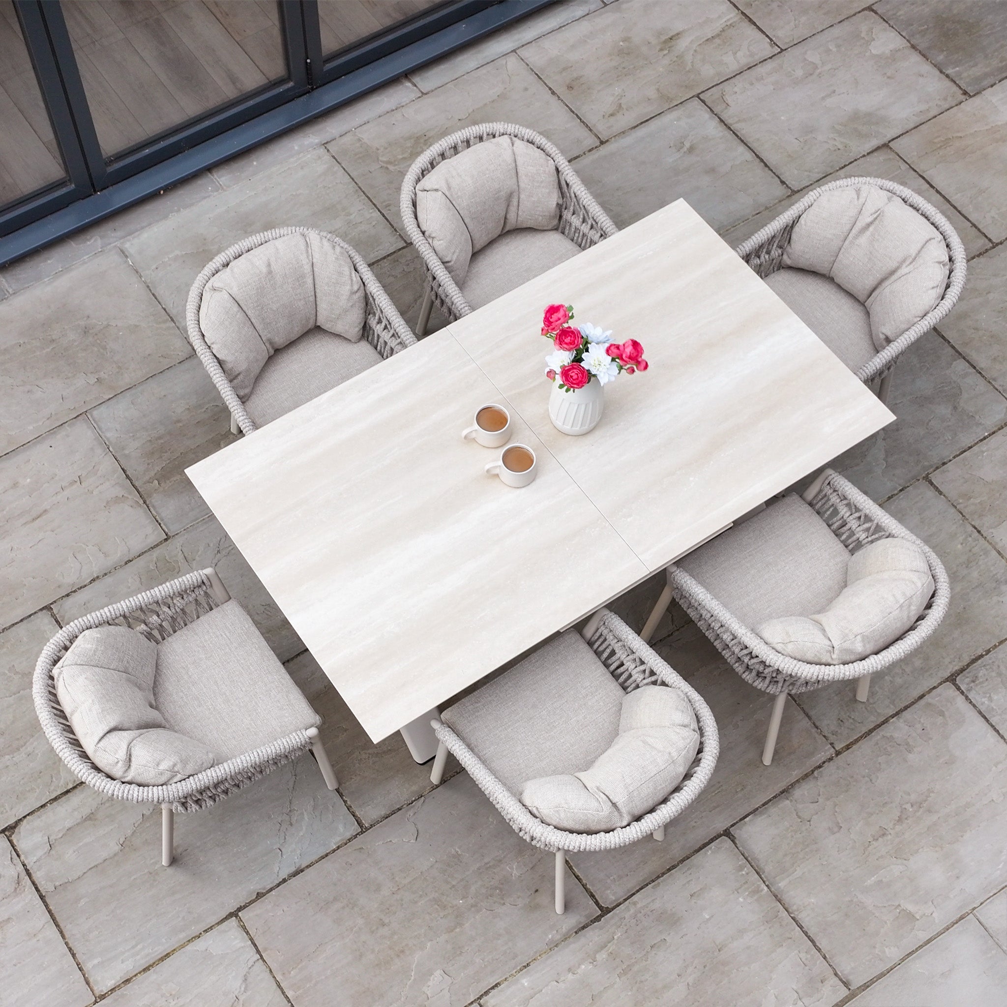 Dine outdoors with the Pello 6 Seat Dining Set, featuring the Albatross Extending Table in Fawn—stylish and spacious patio furniture for memorable alfresco meals.