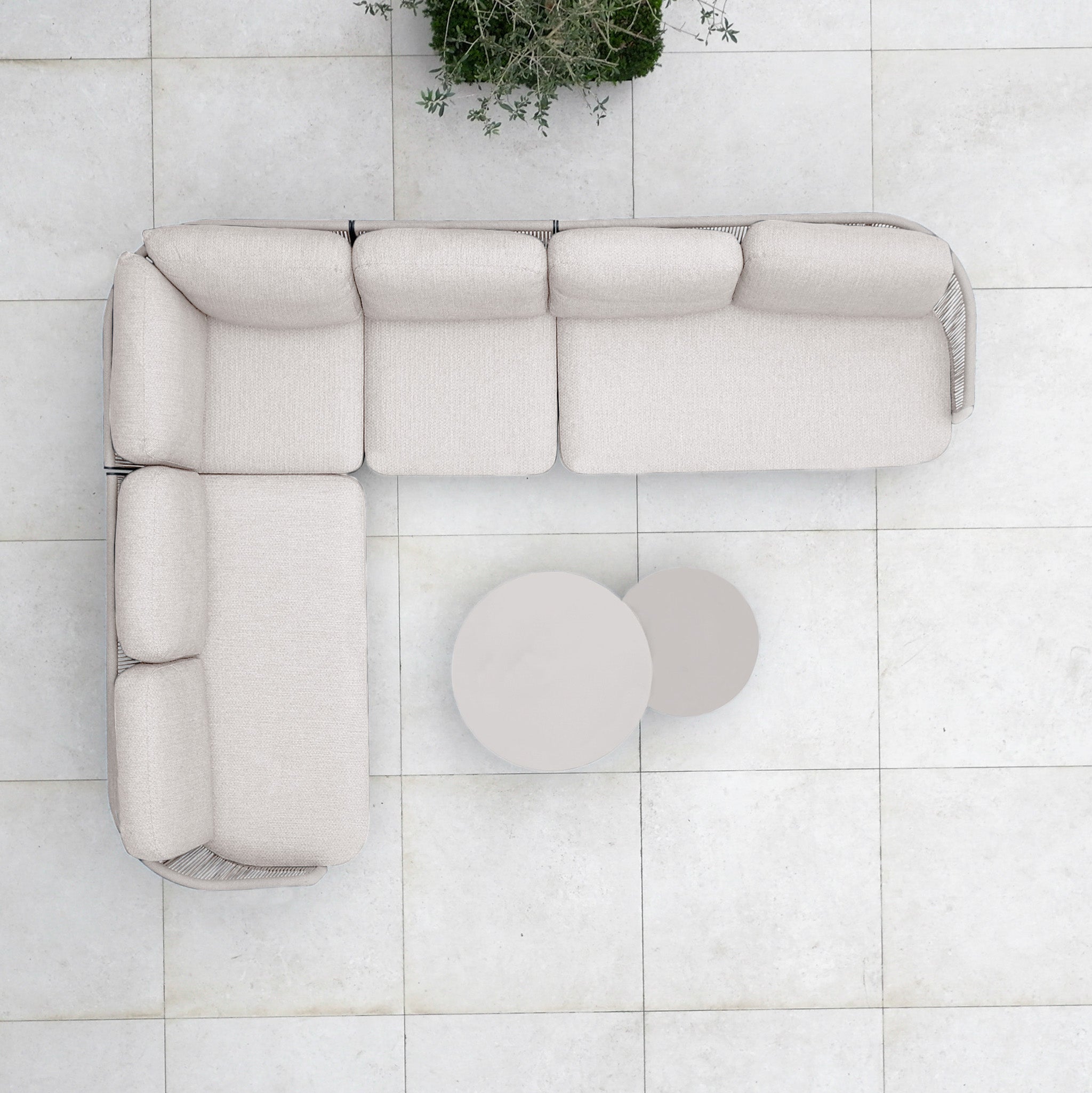 Top view of the Dekota Large Corner Sofa Set in Fawn, an L-shaped sofa with hydrophobic rope weave and two round coffee tables on a tiled floor—ideal for stylish outdoor spaces.