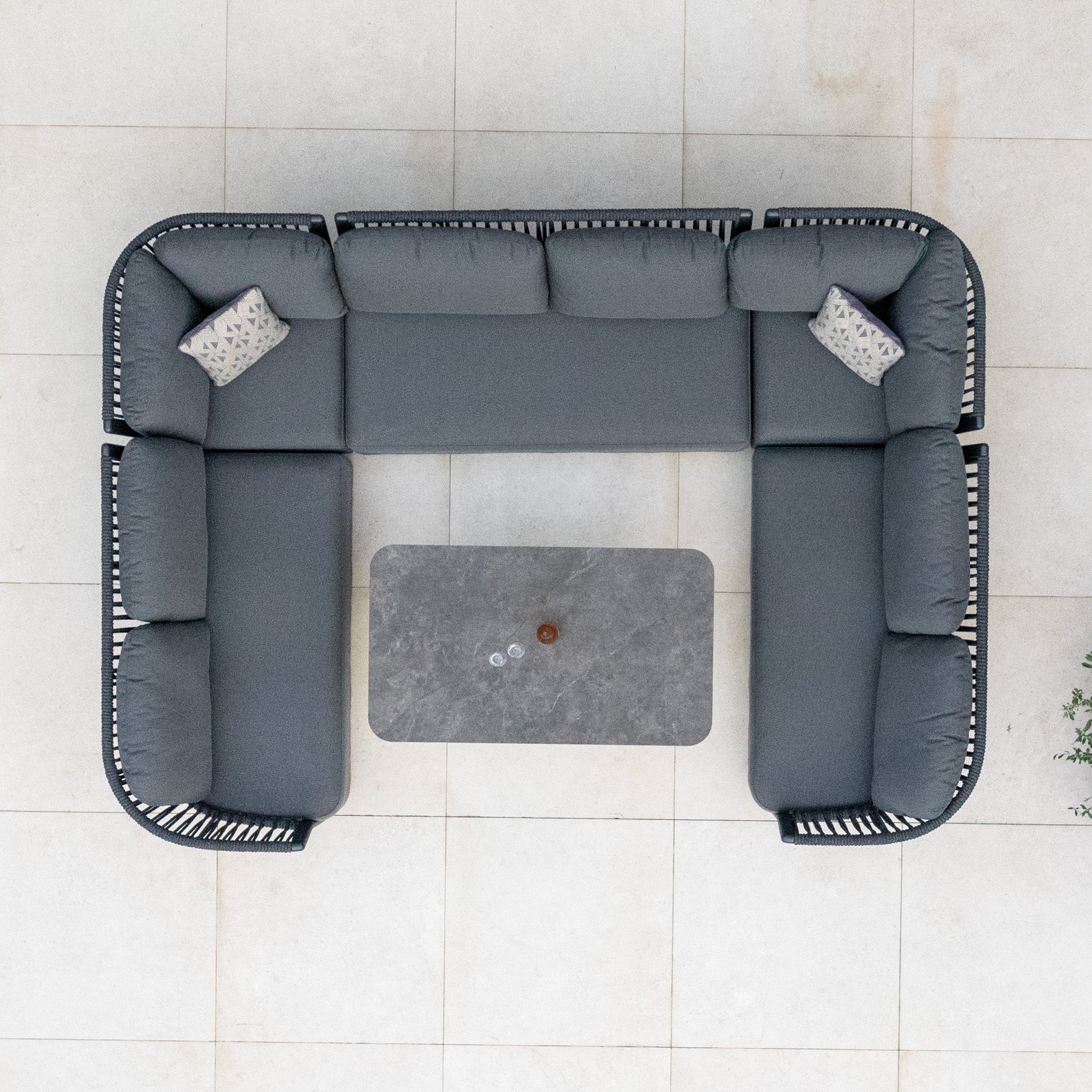Pello U-Shape Corner Sofa Set with Altura Rising Table in Grey, featuring two patterned pillows, viewed from above.