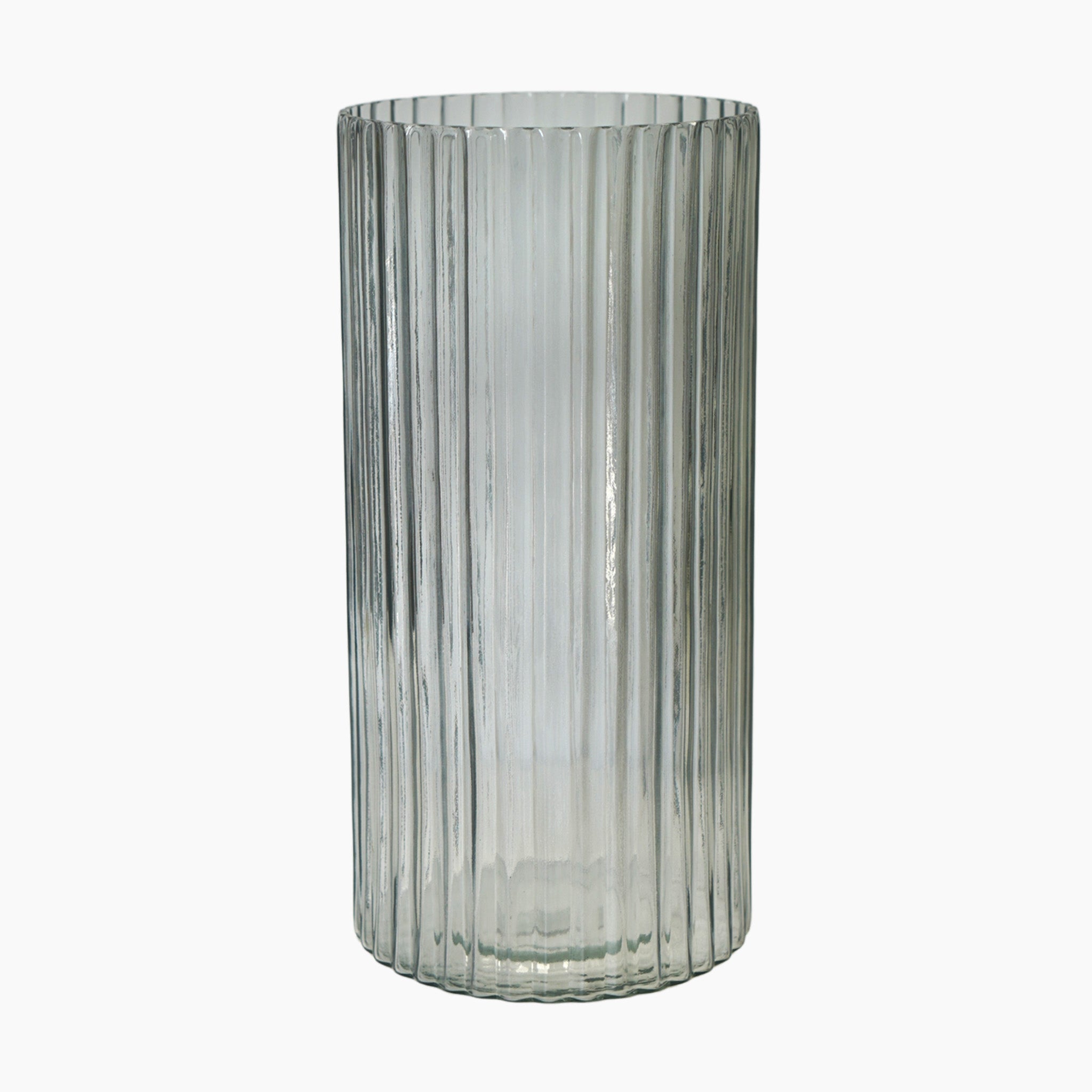 The Ivyline - Daphne Ribbed Vase in Clear features a chic vertical texture, enhancing any décor with its tall, elegant design and commitment to sustainable style.