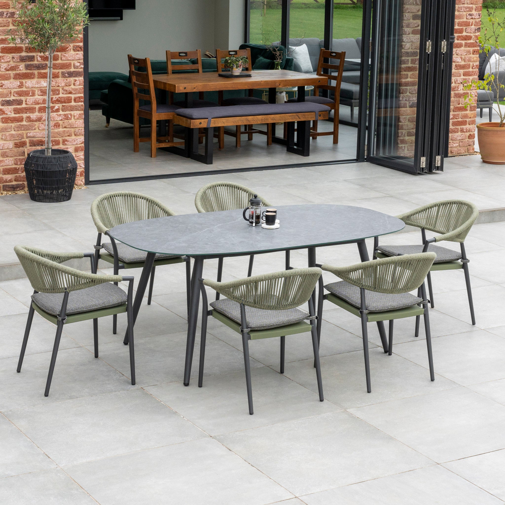 Cloverly 6 Seat Rope Oval Dining Set with Ceramic Table in Green