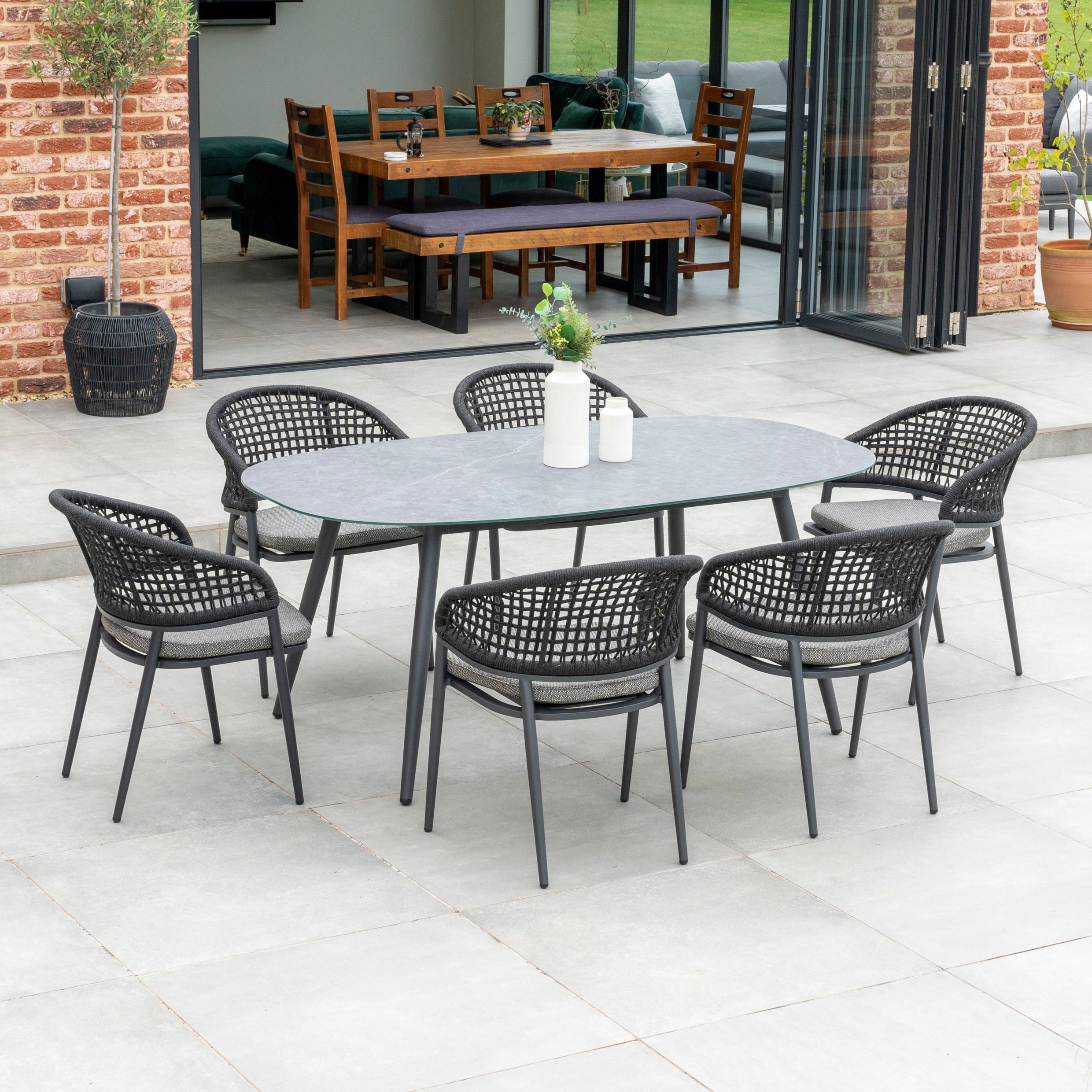 Kalama 6 Seat Rope Oval Dining Set with Ceramic Table in Charcoal