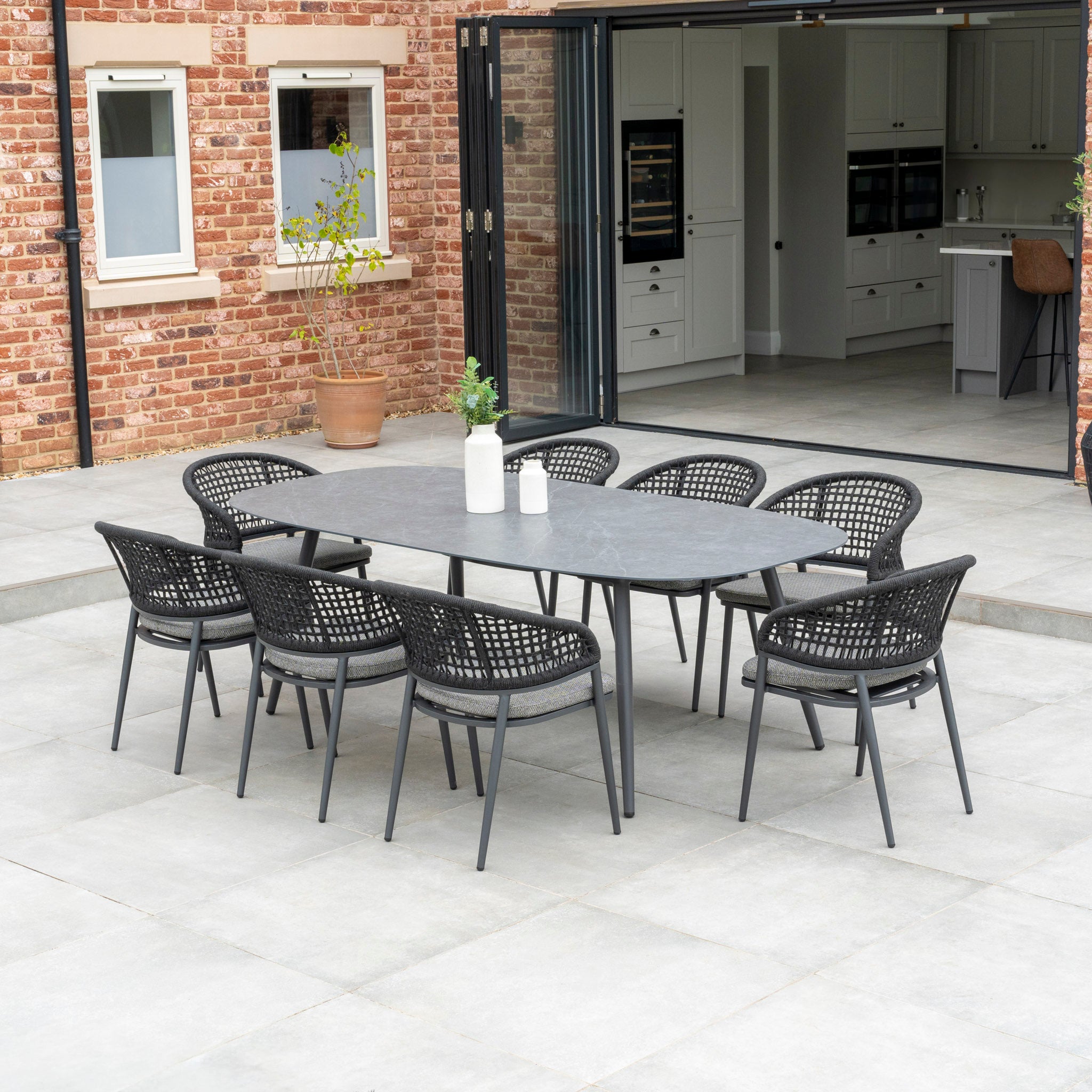 Kalama 8 Seat Rope Oval Dining Set with Ceramic Table in Charcoal