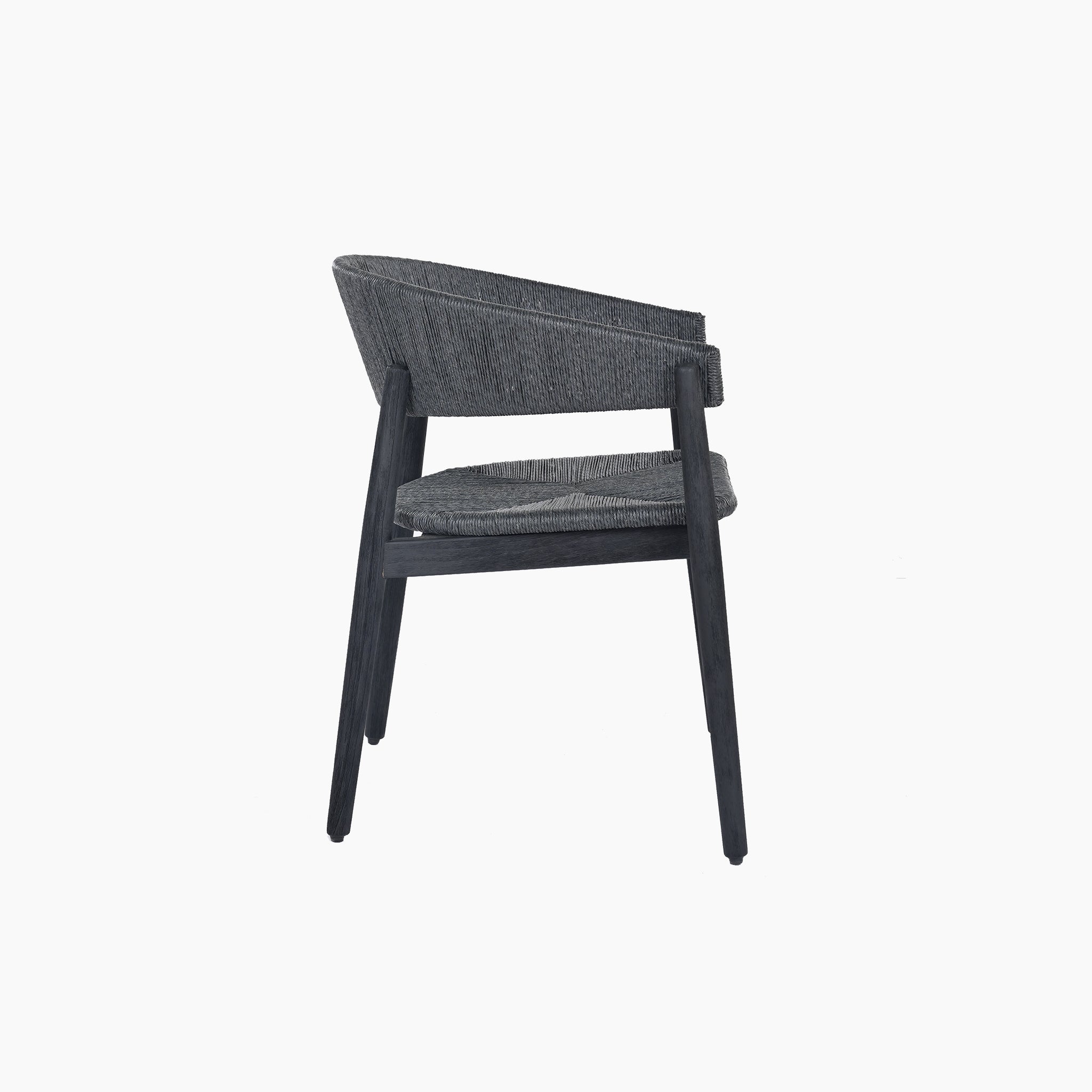 Side view of the Lucca 6 Seat Dining Set with Teak Round Table in Black, featuring a modern gray chair with a curved backrest and four legs, against a white background.