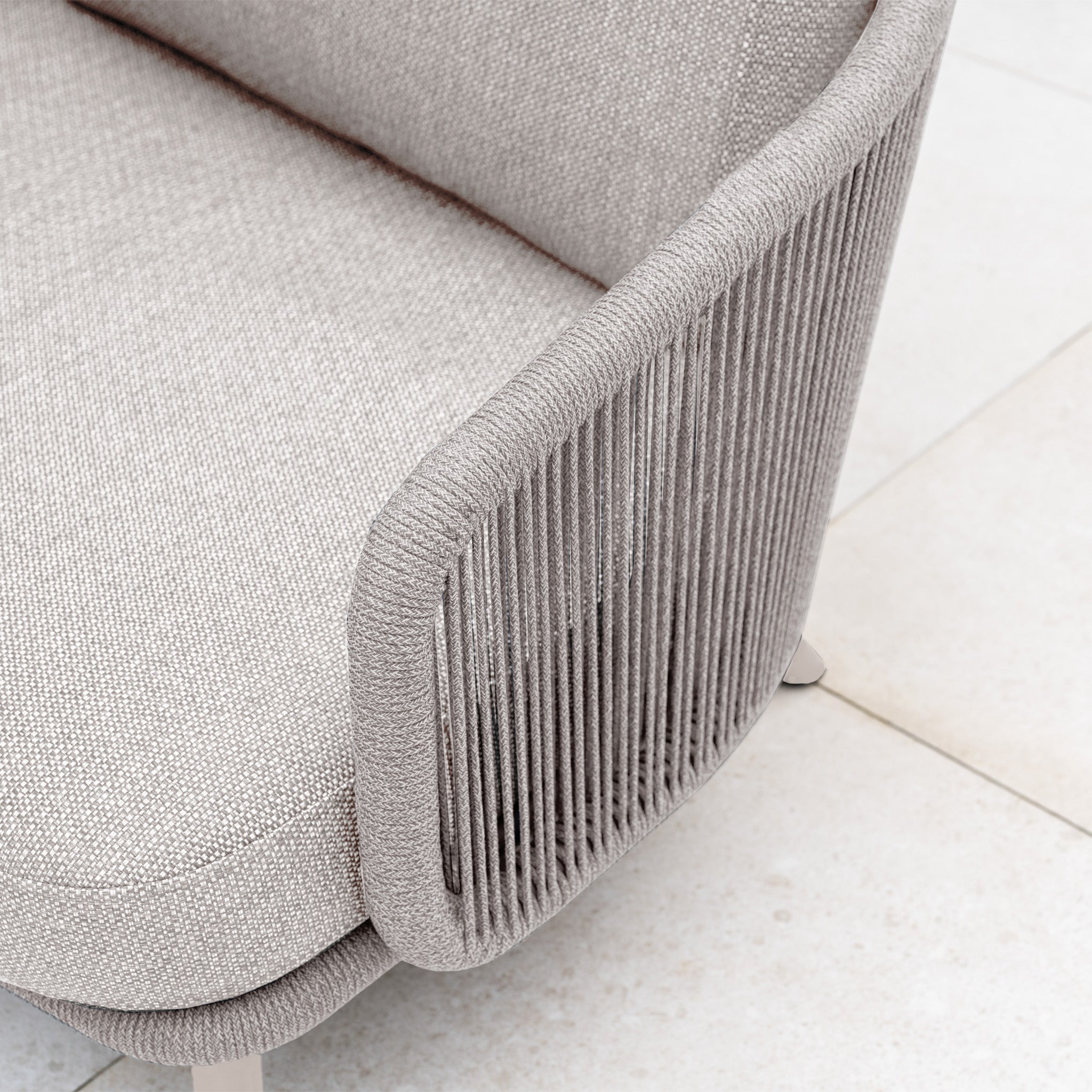 Close-up of the Dekota Corner Sofa Set in Fawn, featuring modern beige fabric and hydrophobic rope weave accents on the armrest and back—ideal for stylish outdoor spaces.