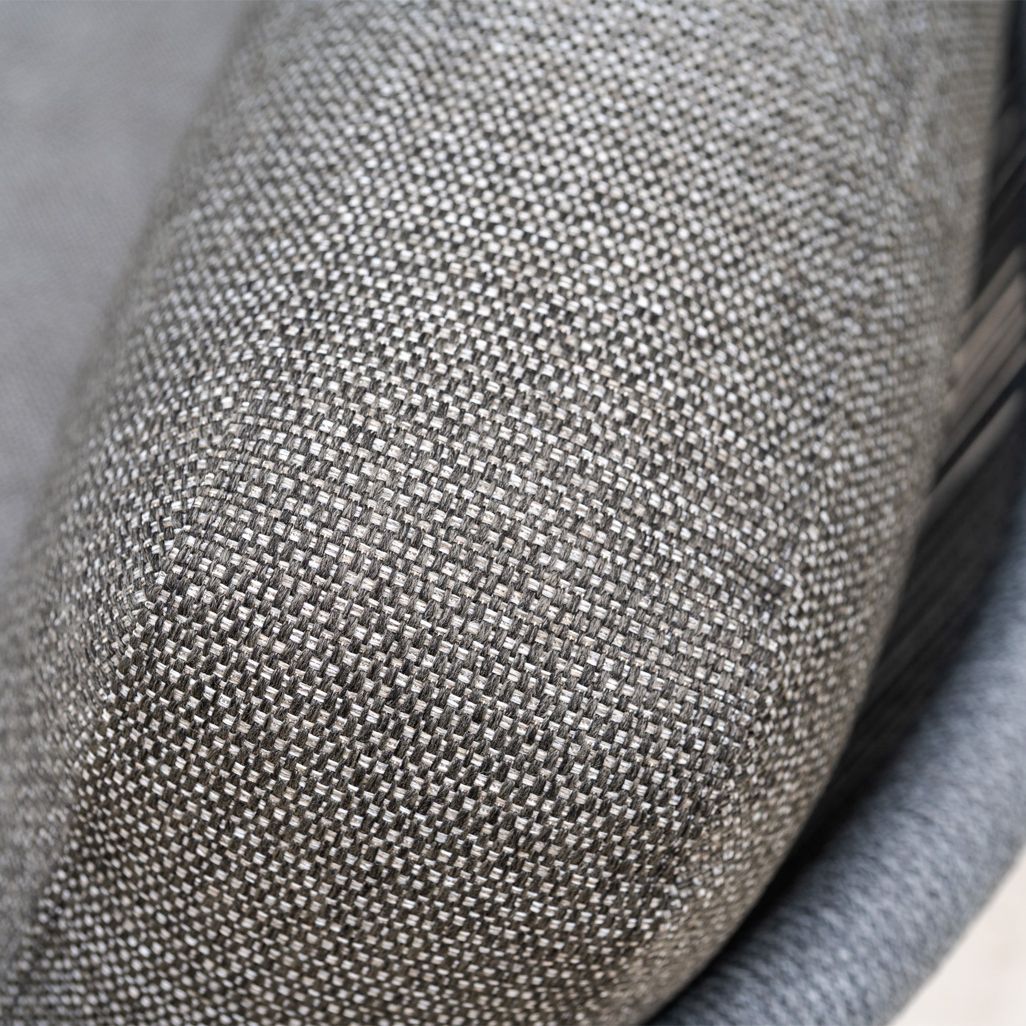 Close-up of a textured, gray Hydrophobic Rope Weave cushion on the Dekota Corner Sofa Set in Charcoal.