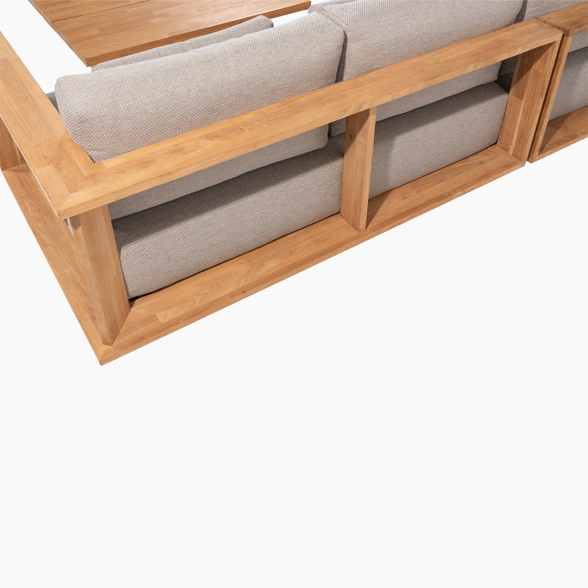 Back view of an Eternity Left Hand Teak Corner Group in light grey with lounge cushions, featuring a wooden frame and open rectangular shelves integrated into the back.