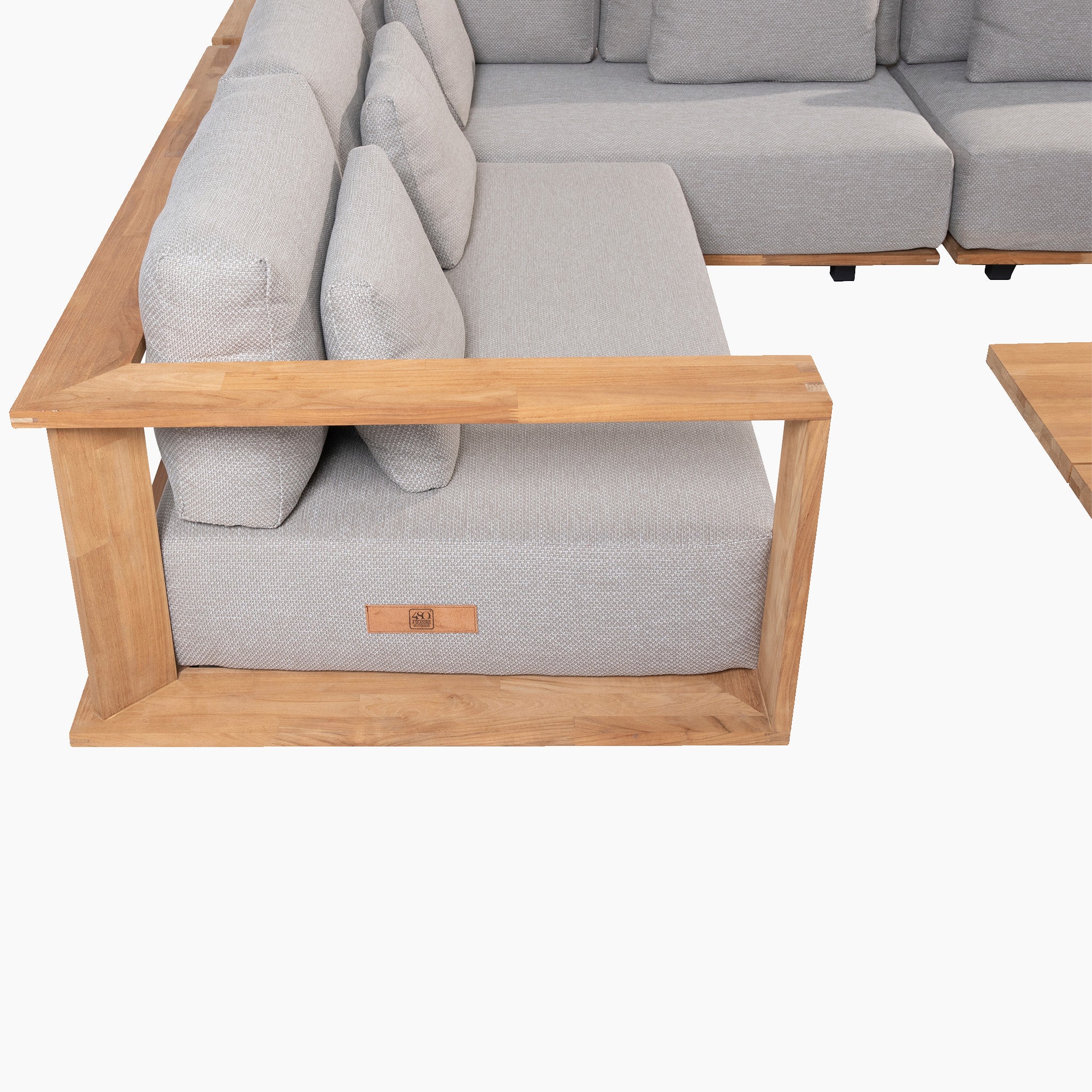 Eternity Left Hand Teak Corner Group in Light Grey, featuring light gray lounge cushions and a wooden frame, with a matching teak corner group table on the right.