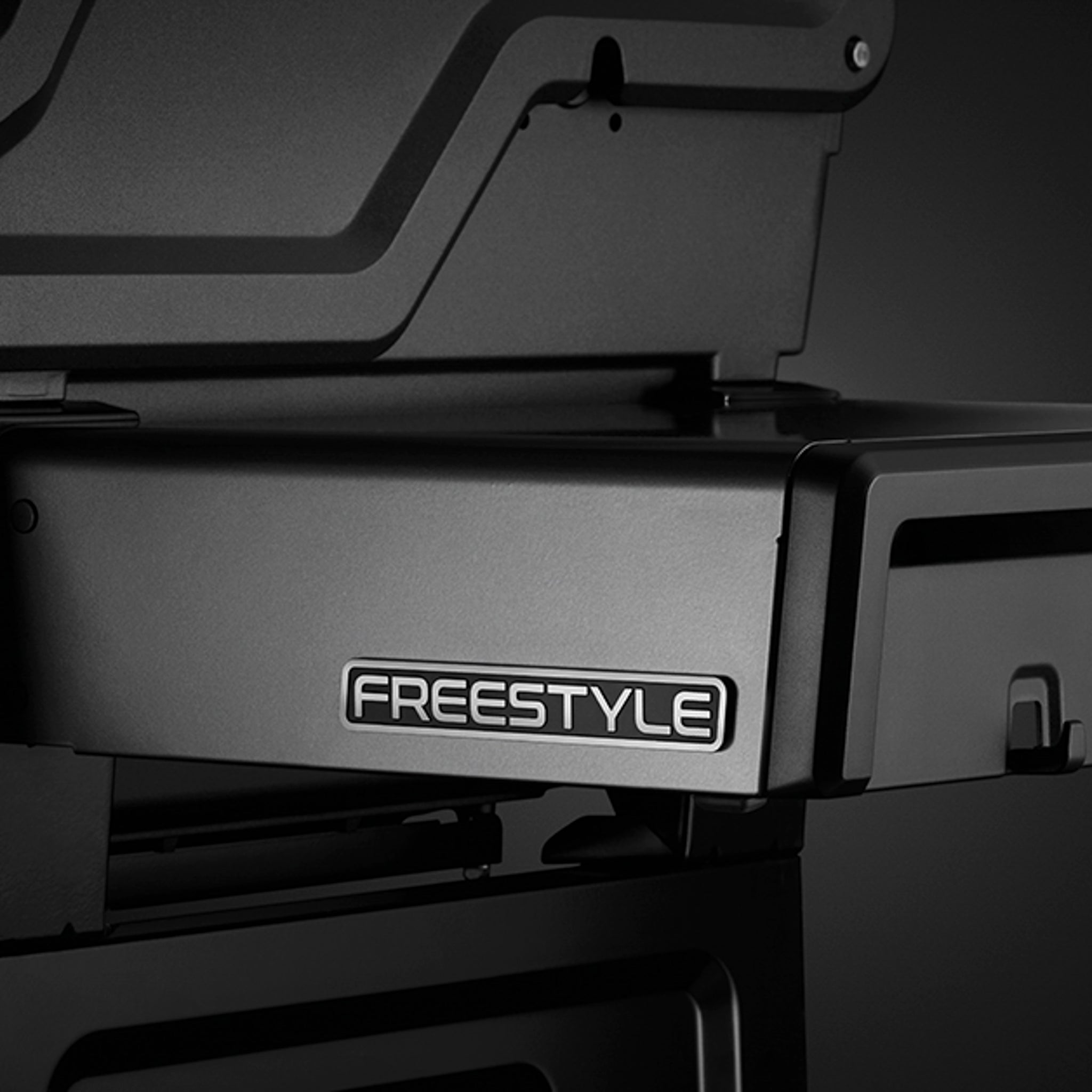 Black and white close-up of a card printer showing the brand name "Napoleon Freestyle 365" on the lower tray, reminiscent of the precision found in a JETFIRE ignition system.