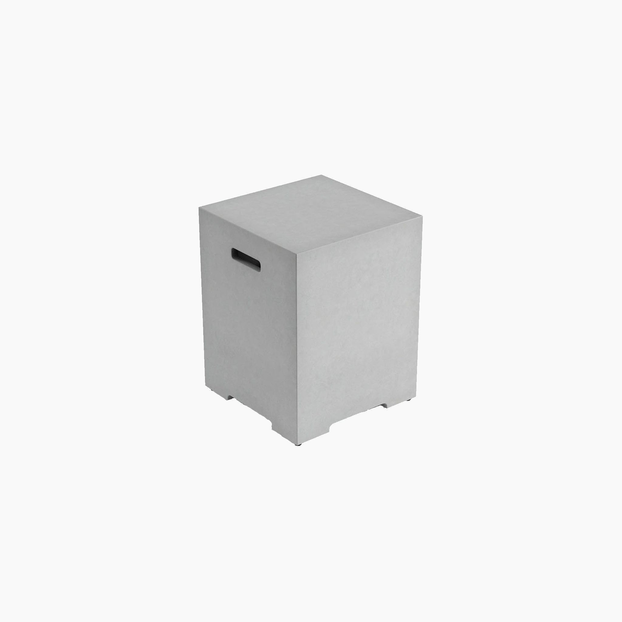 The Ember Gas Storage Box in Stone Grey is a minimalist, cube-shaped stool made from Magnesium Oxide. It features a rectangular cutout handle on one side, making it perfect for your outdoor living space. It sits elegantly on a white background.