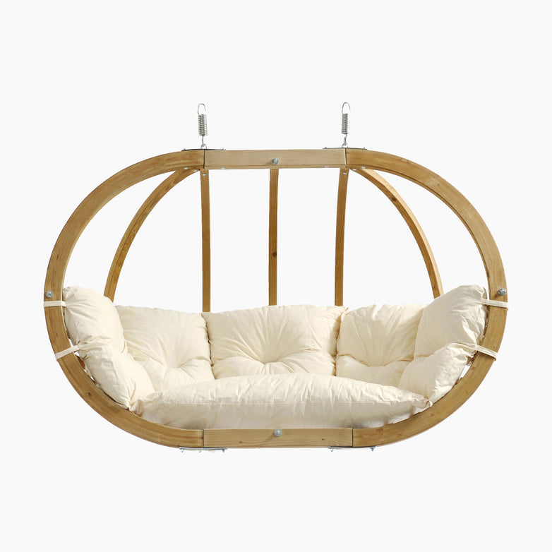 The Globo Royal Double Seater Hanging Chair in Natura features an oval, weatherproof spruce wood frame with a cream cushioned seat, suspended by metal hooks—ideal for relaxing outdoors and pairing with the Globo Royal Double Hammock Stand.
