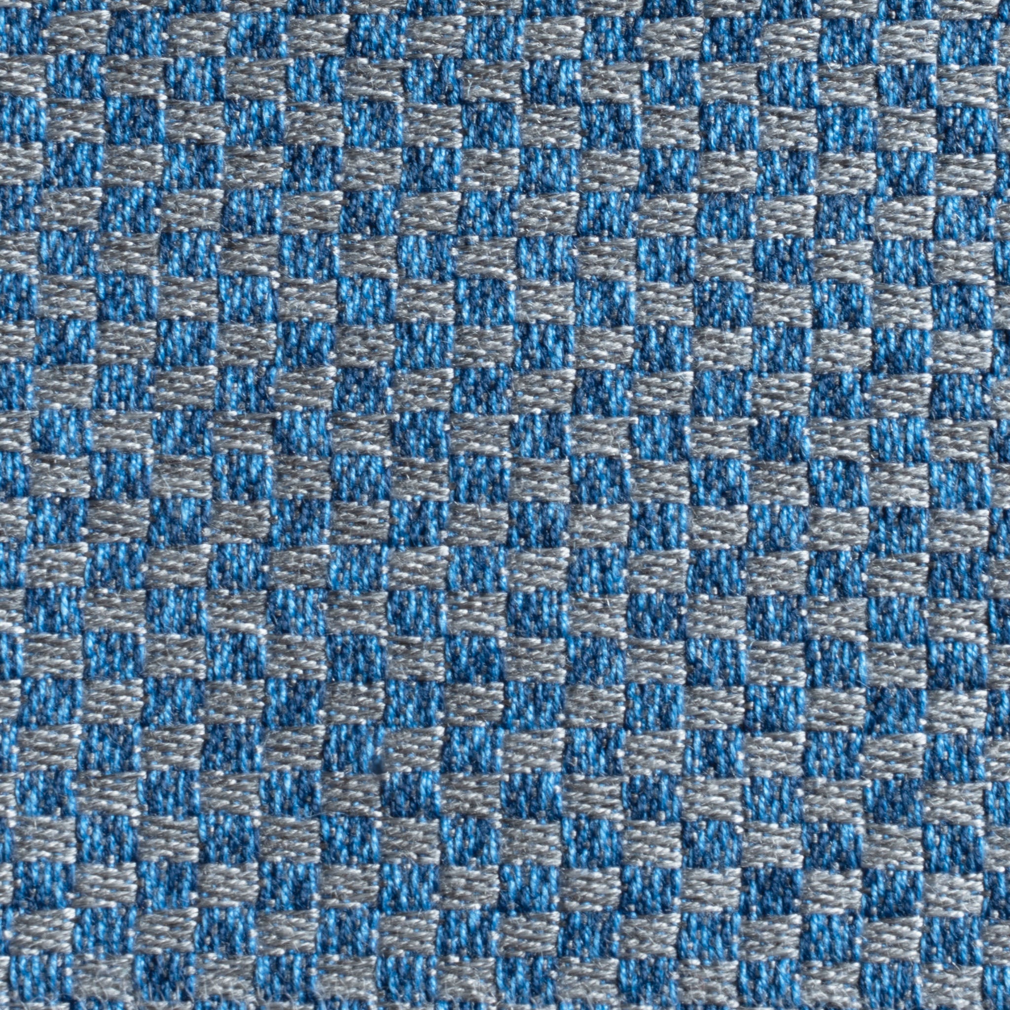 Close-up of Agora Senda Blue Medium Scatter Cushion (45cm x 45cm), featuring blue and gray solution-dyed acrylic fabric with a small checkered pattern—perfect for outdoor use or pairing with an outdoor cushion storage bag.