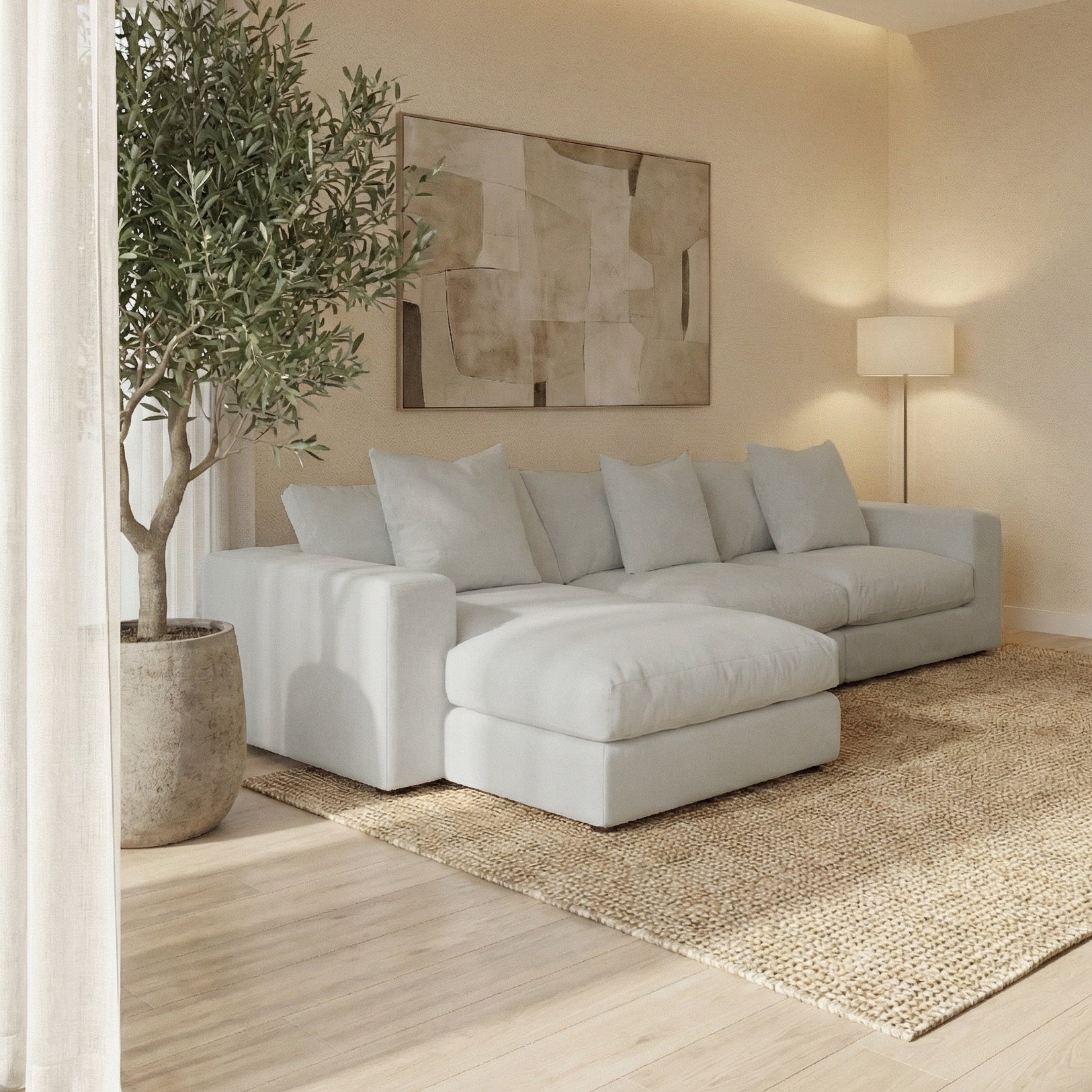 Modern living room featuring the Hampshire Modular 3 Seat Sofa in Classic Grey, potted tree, rug, floor lamp, and abstract wall art.