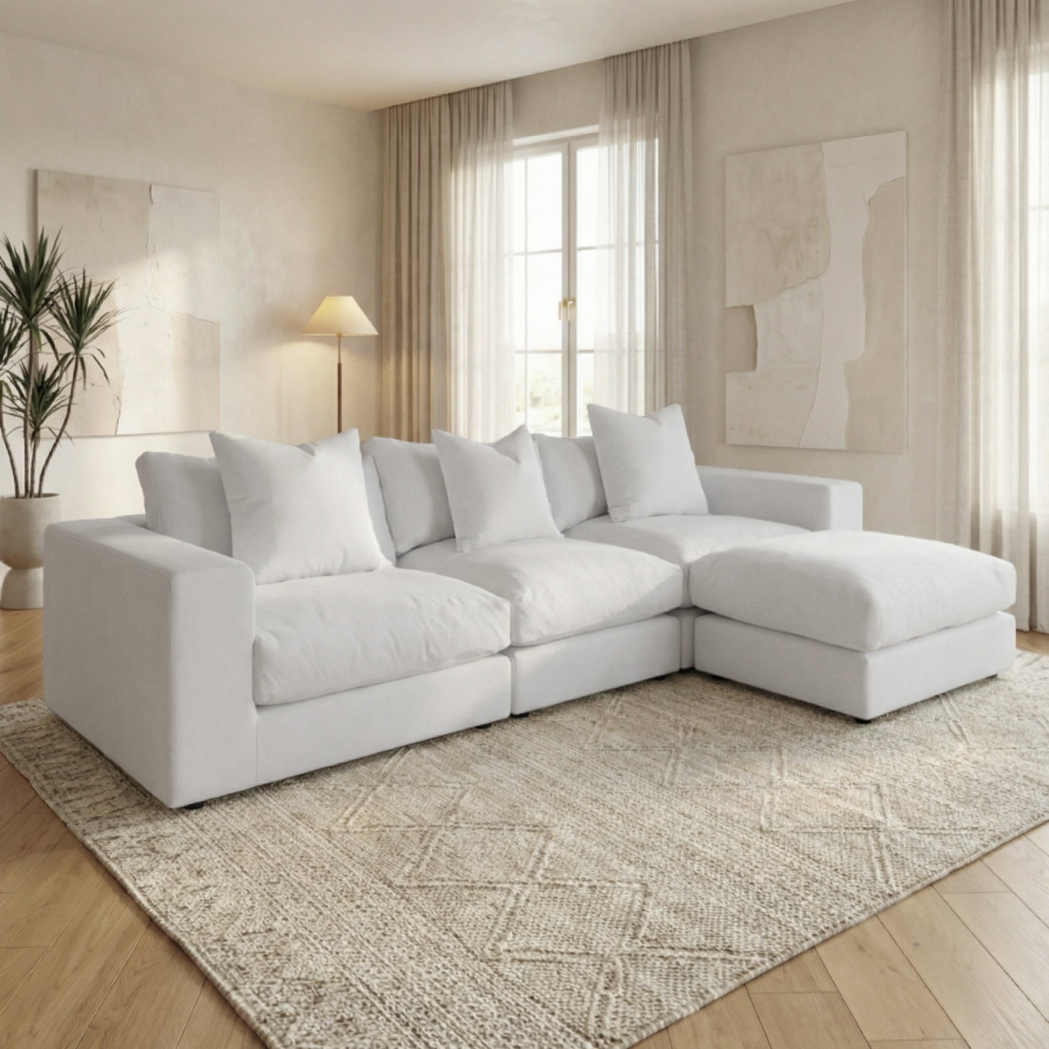 The Hampshire Modular 3 Seat Sofa in Dove Grey features large duck feather cushions, perfect for a bright, modern living room with neutral decor and natural light.