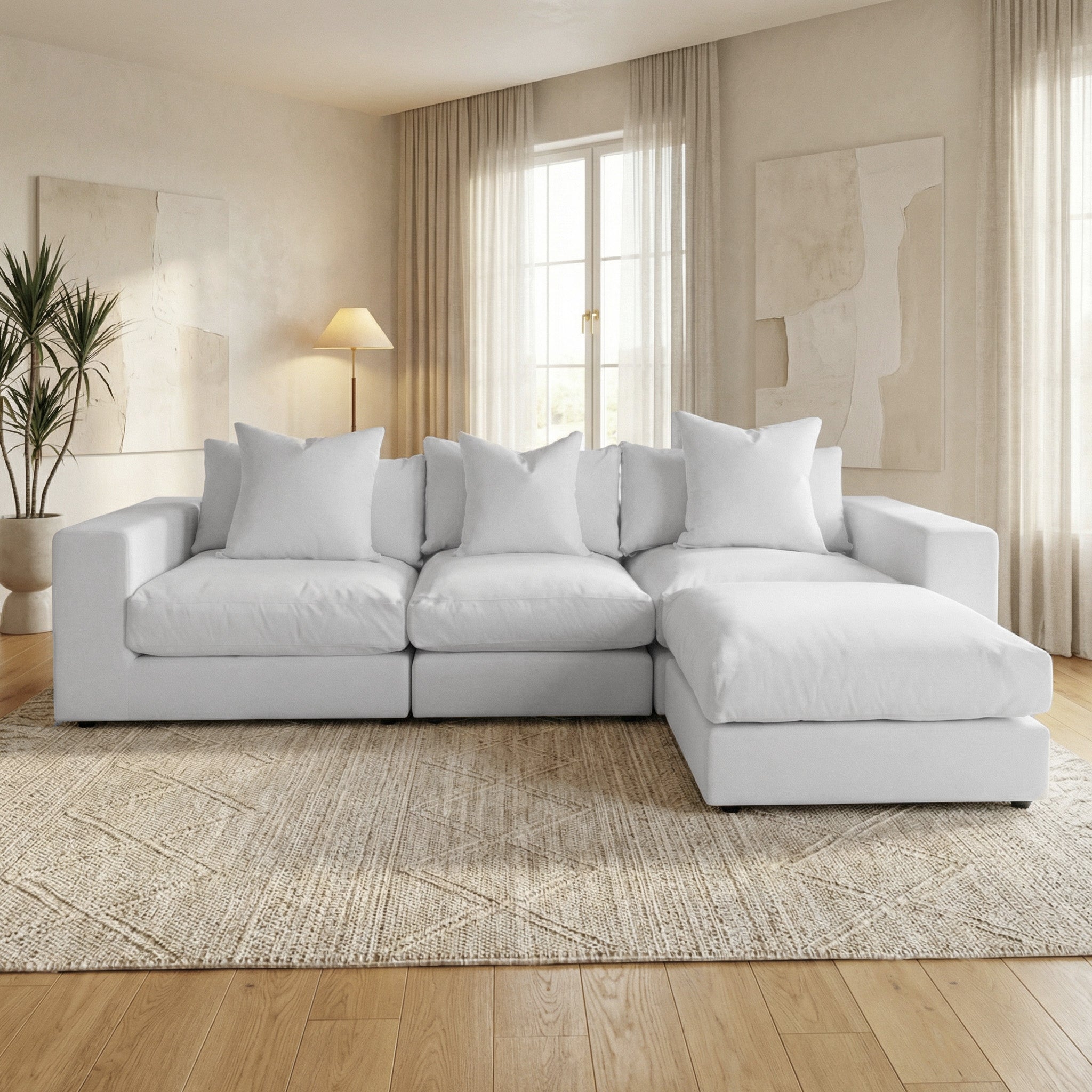 Modern living room featuring the Hampshire Modular 3 Seat Sofa in Dove Grey with plush duck feather cushions, neutral decor, and abundant natural light.