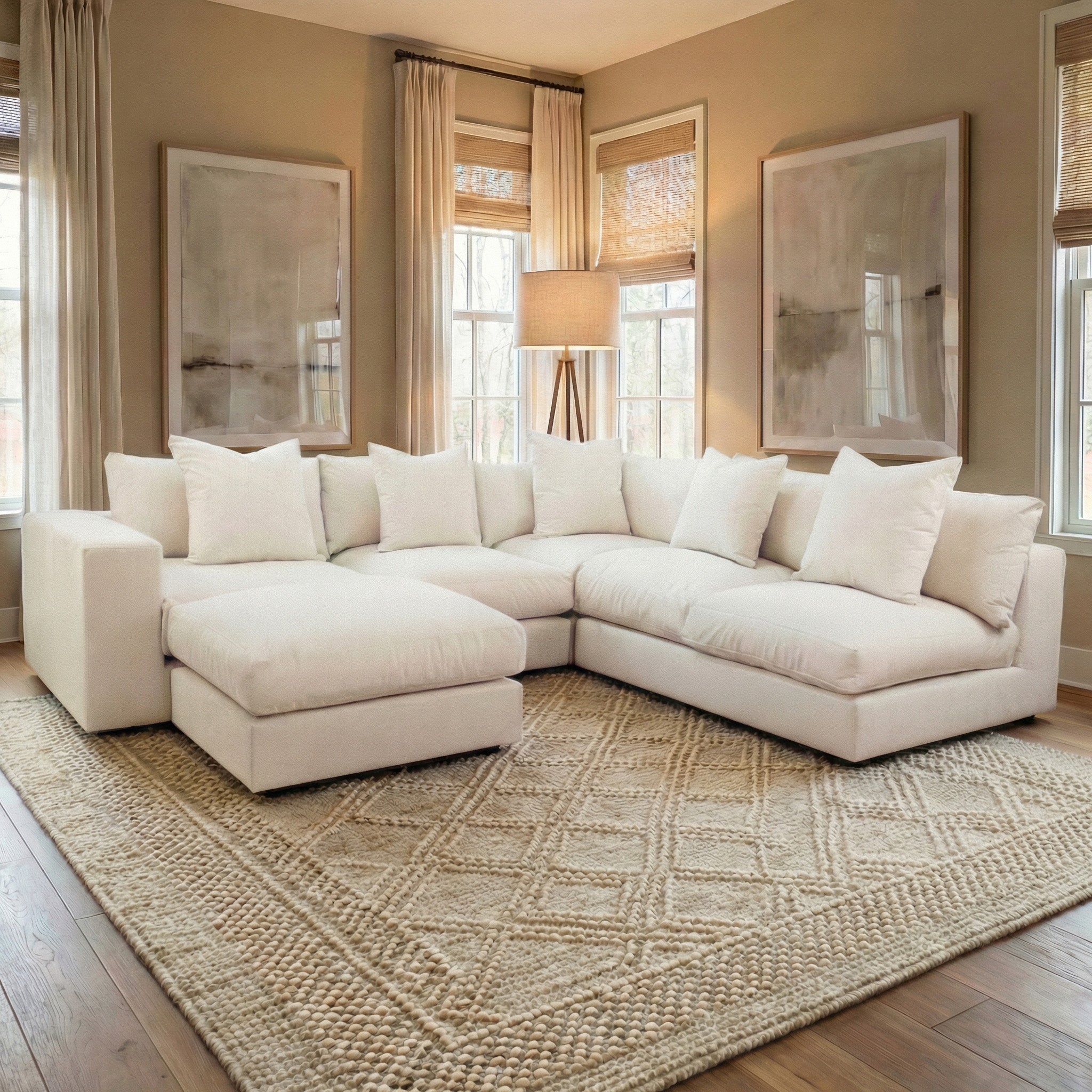 Modern living room featuring the Hampshire Modular Corner Sofa in Ivory, neutral decor, and a textured rug—expertly handmade in England for comfort and style.
