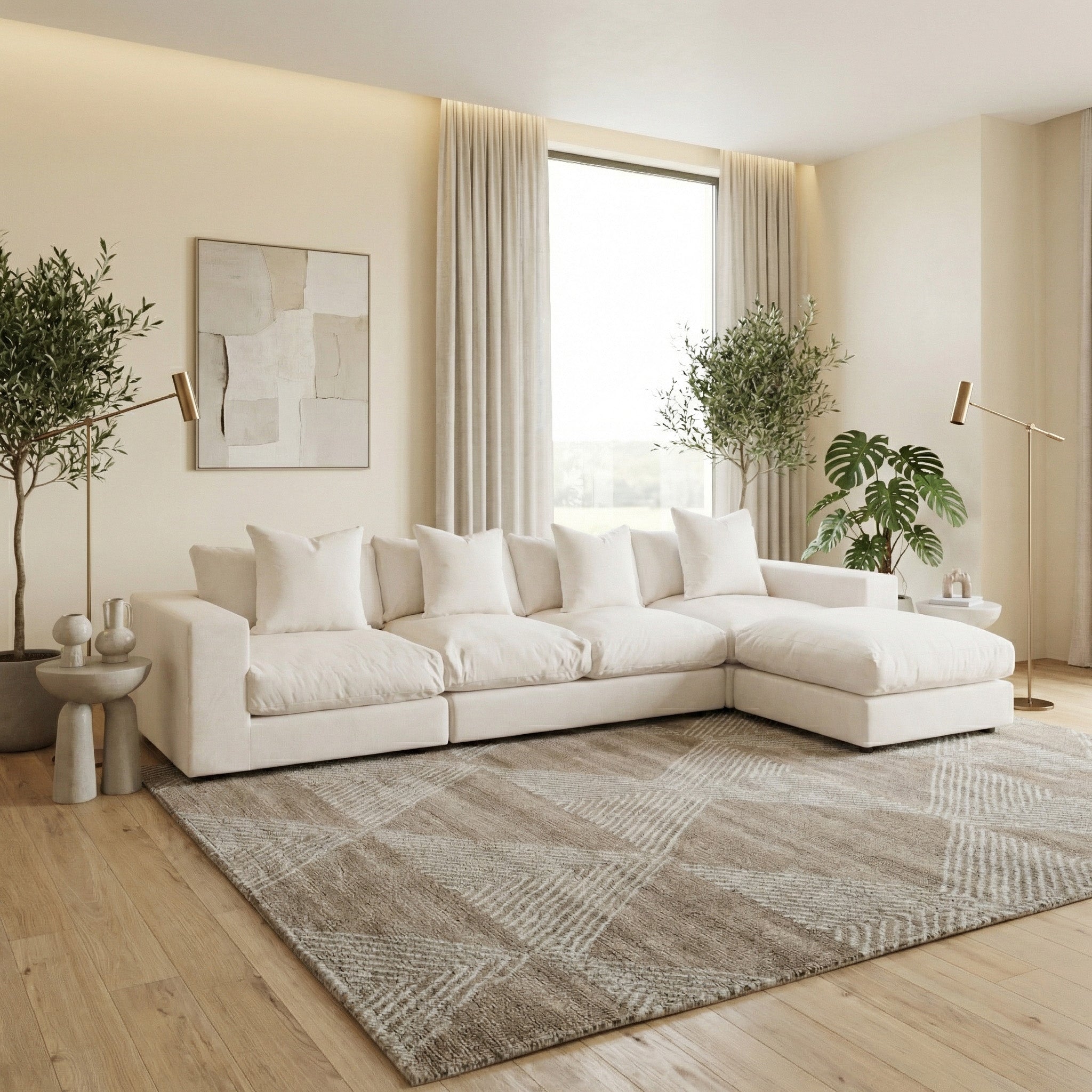 Modern living room featuring the Hampshire Modular 4 Seat Sofa in Beige with duck feather cushions, neutral decor, large window, plants, and a patterned rug.