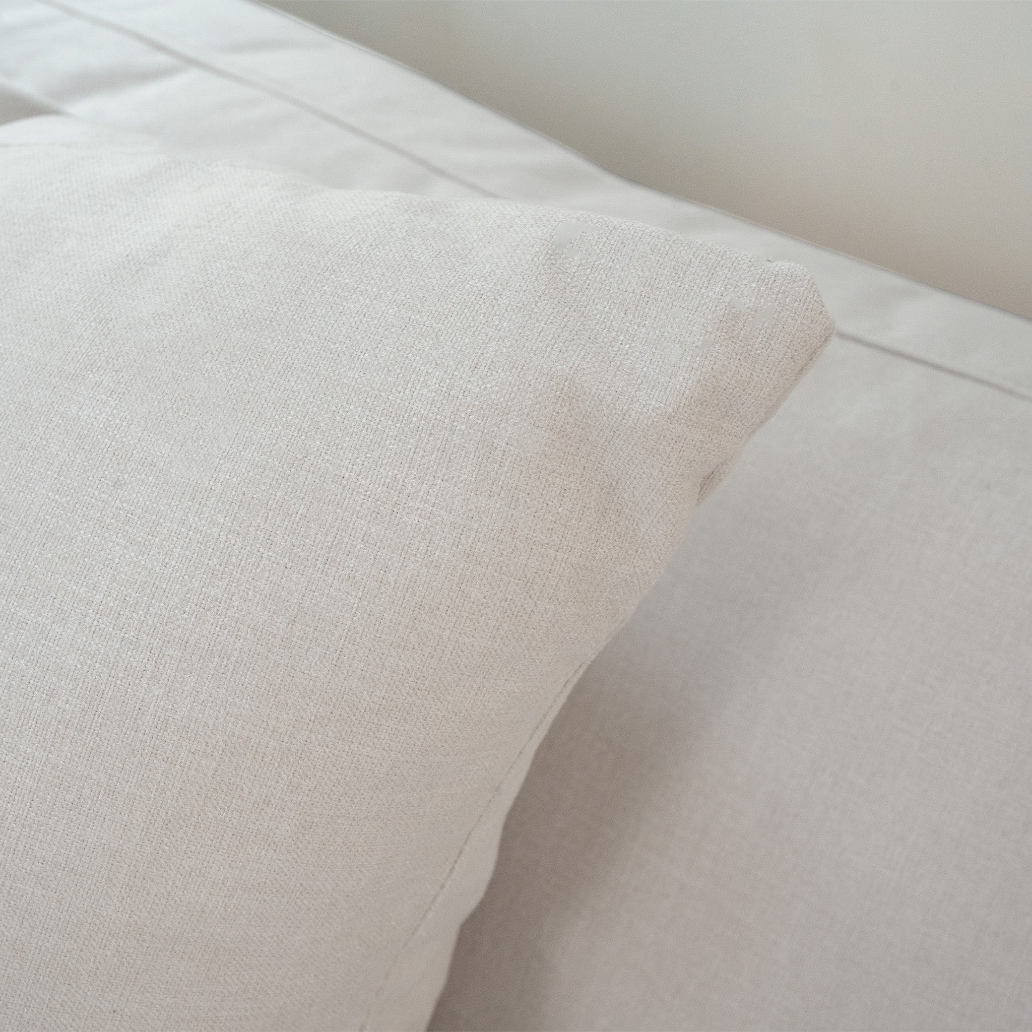 Close-up of the Hampshire Modular Corner Sofa in Warm Grey, showcasing its plush comfort and sophisticated upholstery reminiscent of luxurious duck feather cushions.