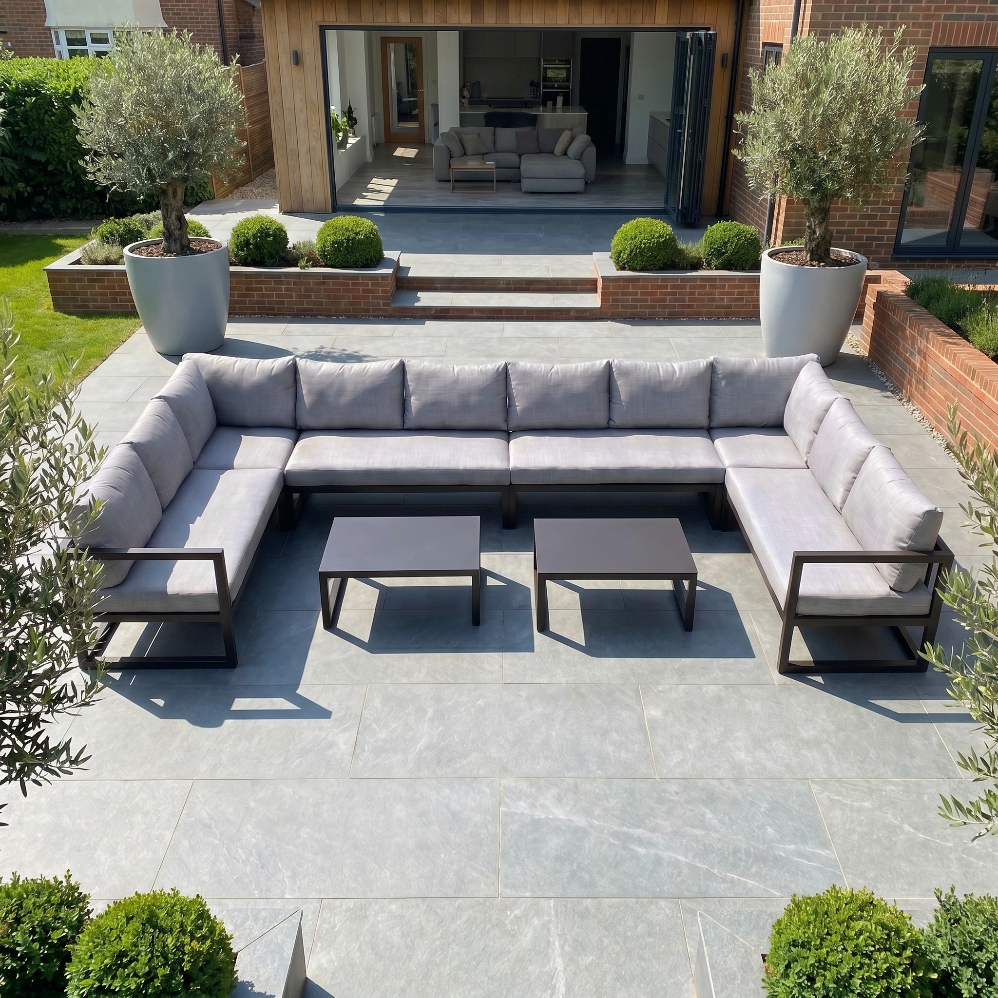 The Havana U-Shape Corner Group Set with Reclining Feature and Coffee Tables in Washed Grey features plush cushions and twin tables, making it a modern, stylish focal point for your outdoor space.