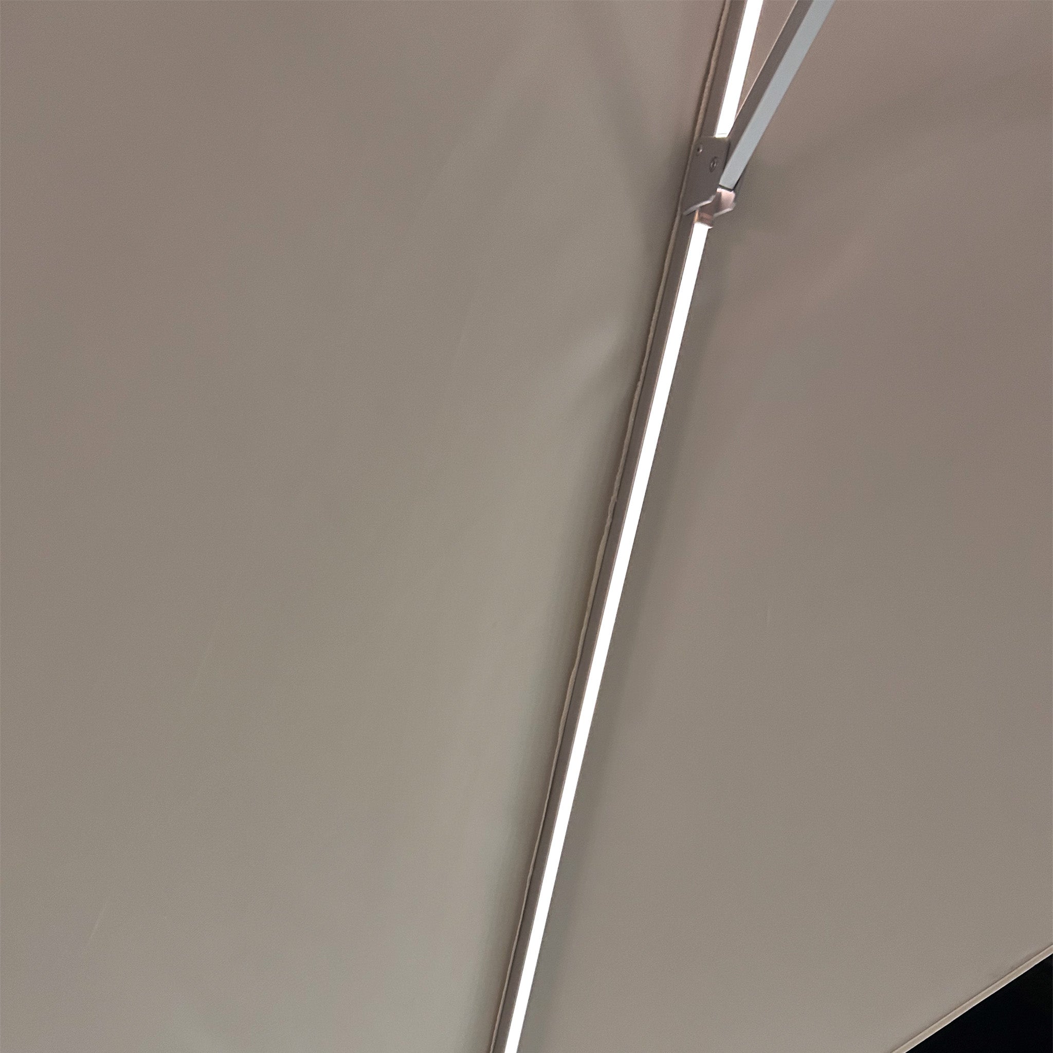 The Zelos 3m x 2m Rectangular Parasol in Cream features integrated LED lighting, providing a long, bright illumination with UV protection.