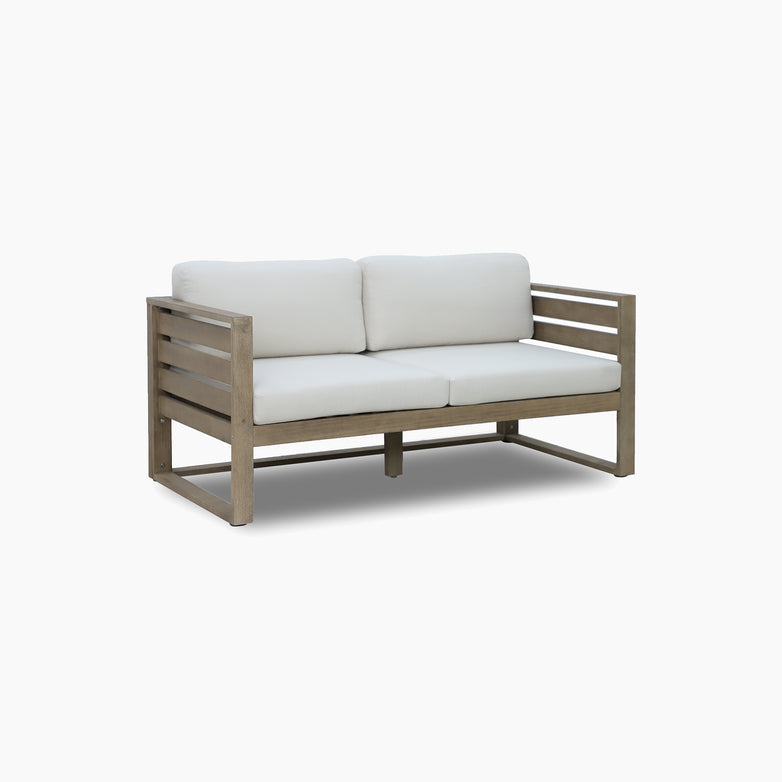The Andora 2 Seat Sofa in Weathered Brown and Linen features a eucalyptus wood frame with white seat and back cushions, shown against a plain white background.