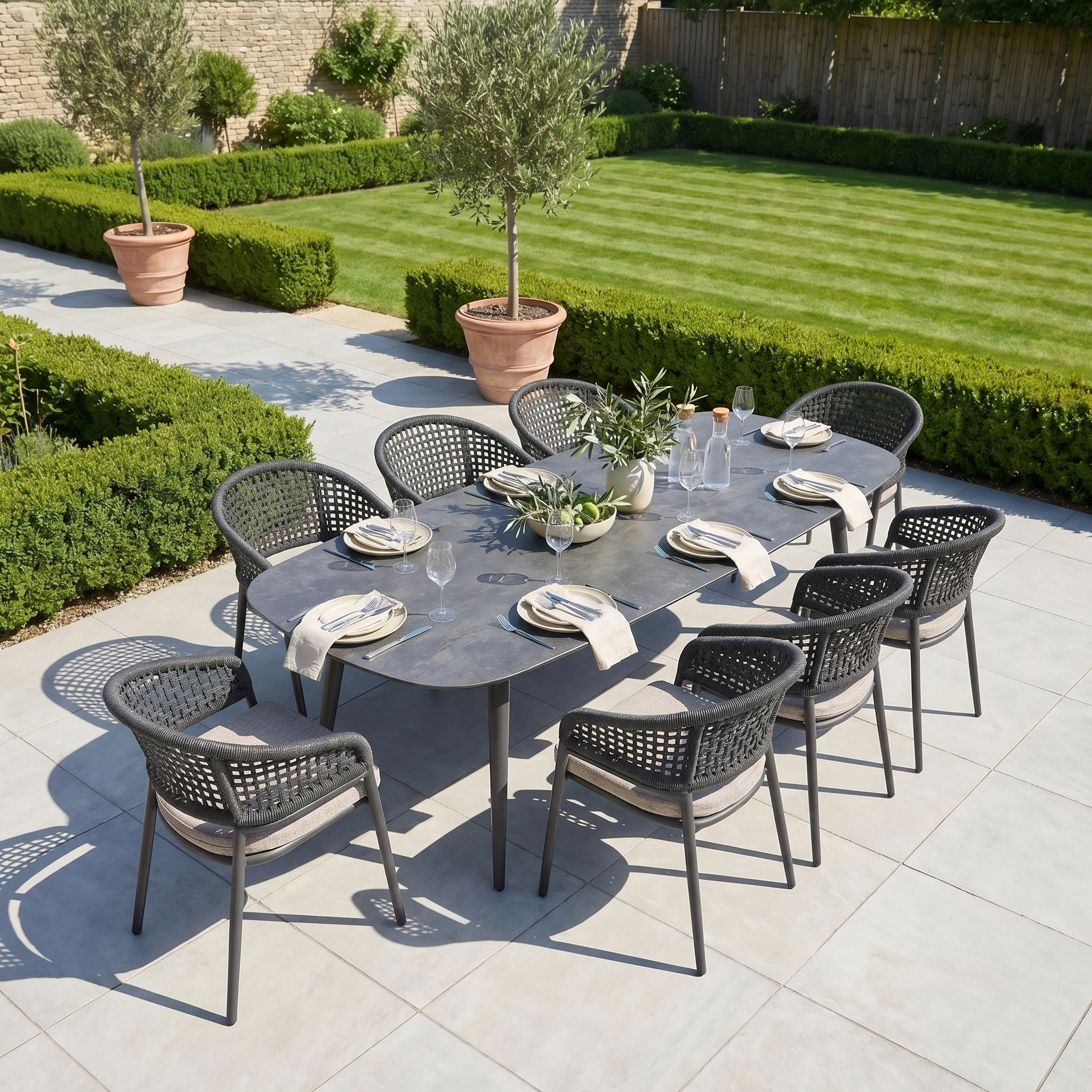 The Kalama 8 Seat Oval Rope Dining Set in Truffle offers elegant outdoor dining with durable materials, ideal for patios and gardens.