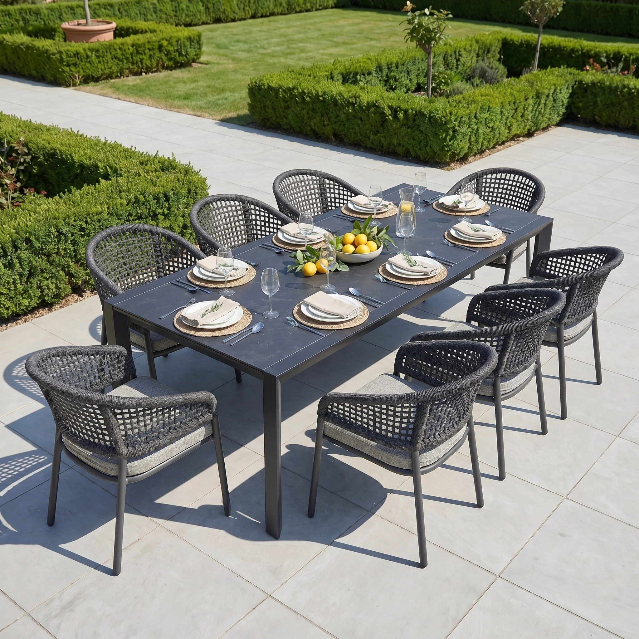 The Kalama 8 Seat Extending Dining Set with Ceramic Table in Truffle features woven chairs and durable aluminium frames, creating a stylish patio dining space perfect for gatherings and outdoor entertaining.