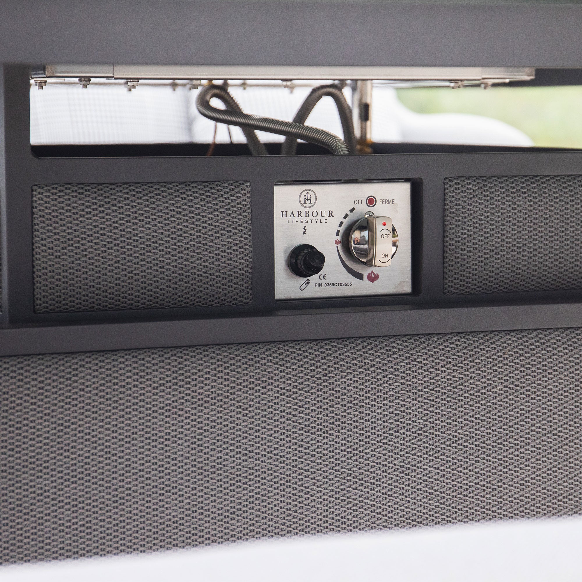 Close-up of a Harbour Lifestyle heater's control panel with switches and indicators for operation, perfect for complementing your Luna U-Shape Outdoor Fabric Corner Dining with Rising Firepit Table in Grey.