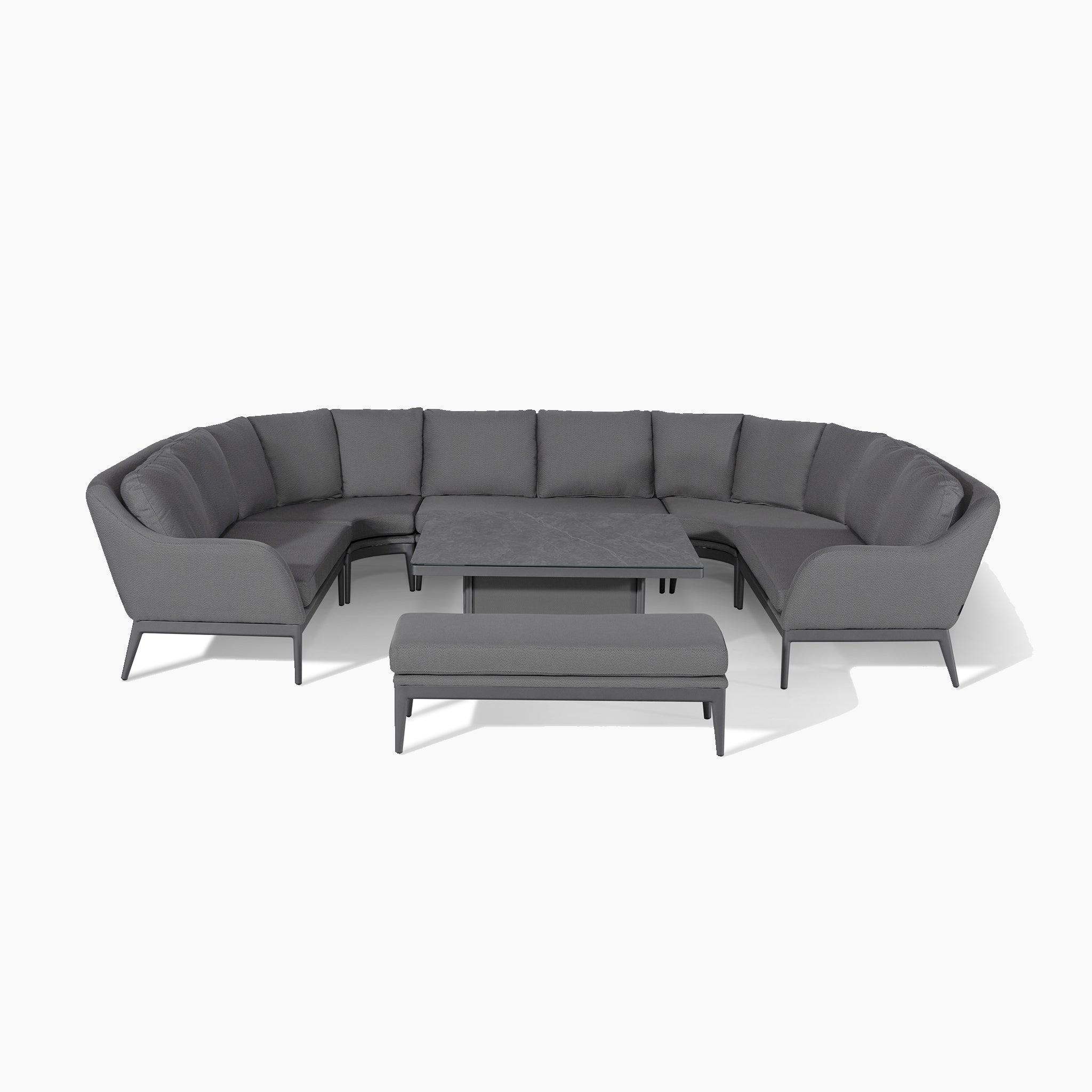 The Luna U-Shape Outdoor Fabric Corner Dining with Rising Table in Grey features a curved sectional sofa set with gray cushions, complemented by a central rising coffee table and a matching gray bench.