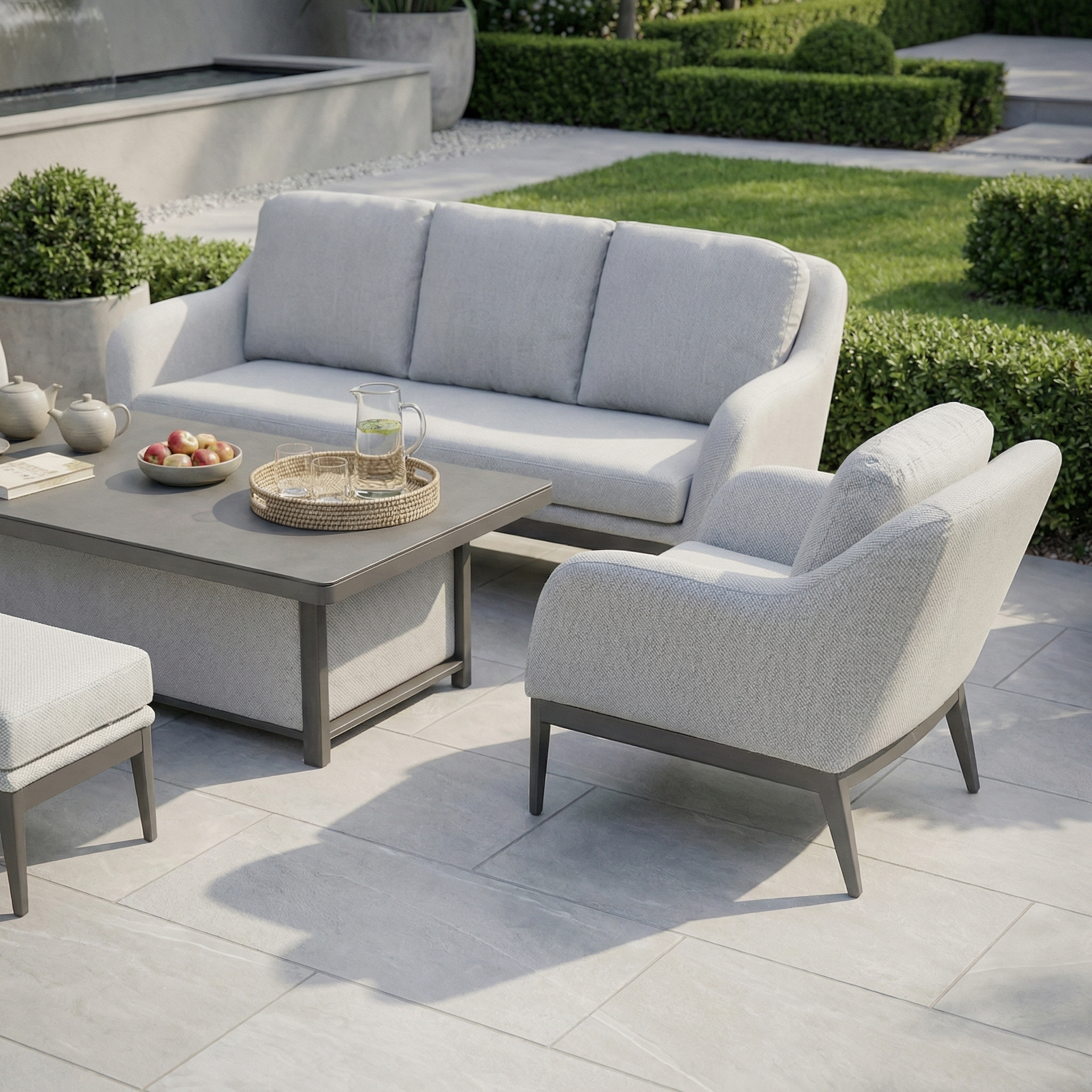 The Luna 3 Seat Outdoor Fabric Sofa Set with Rising Table in Oyster Grey includes a sofa, chair, table, and ottoman—crafted from all-weather materials for easy outdoor living on your patio.