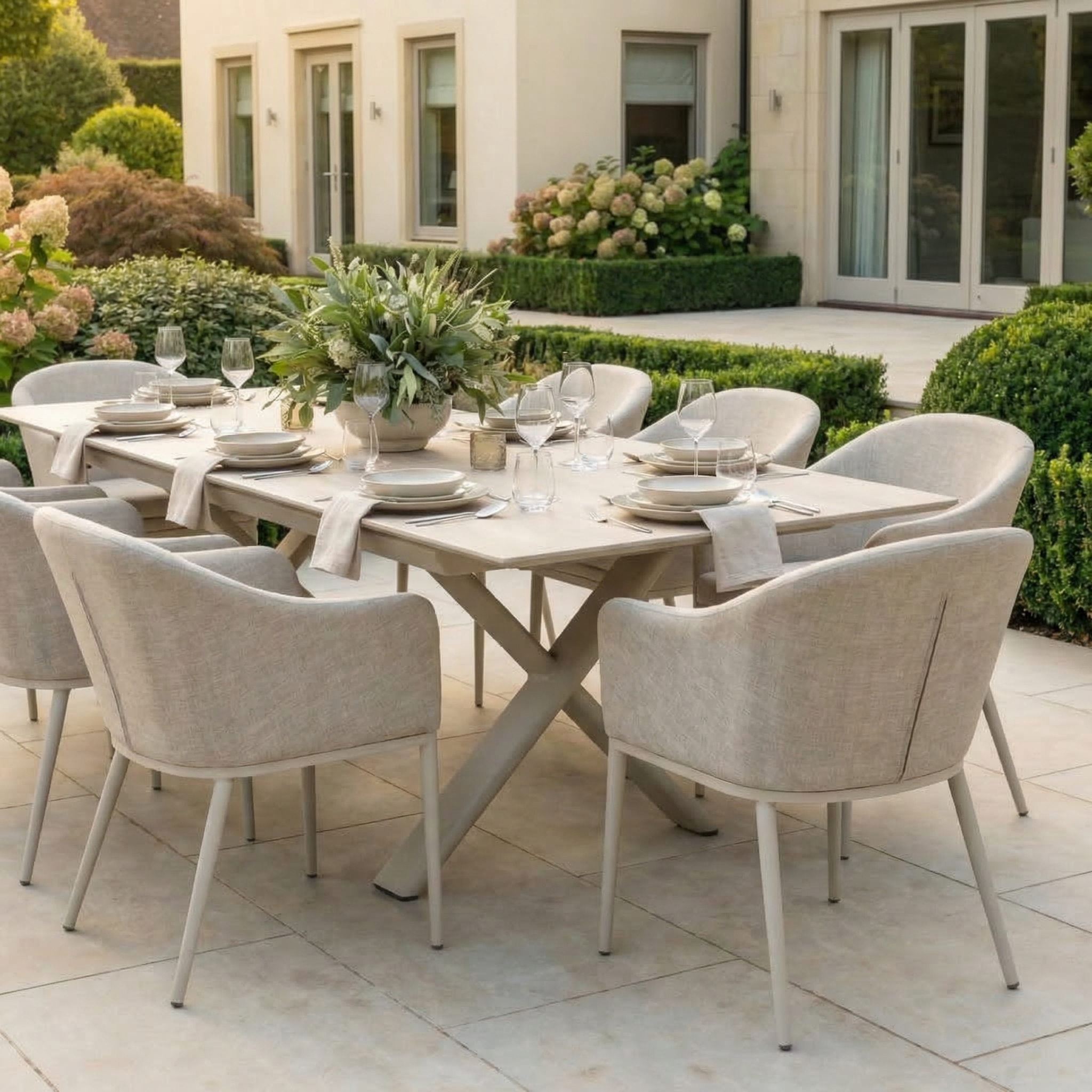 The Luna 8 Seat Outdoor Fabric Dining Set with Albatross Extending Table in Fawn offers stylish, weather-resistant seating and an elegant centerpiece for outdoor dining—perfect for gathering family and friends on your patio.
