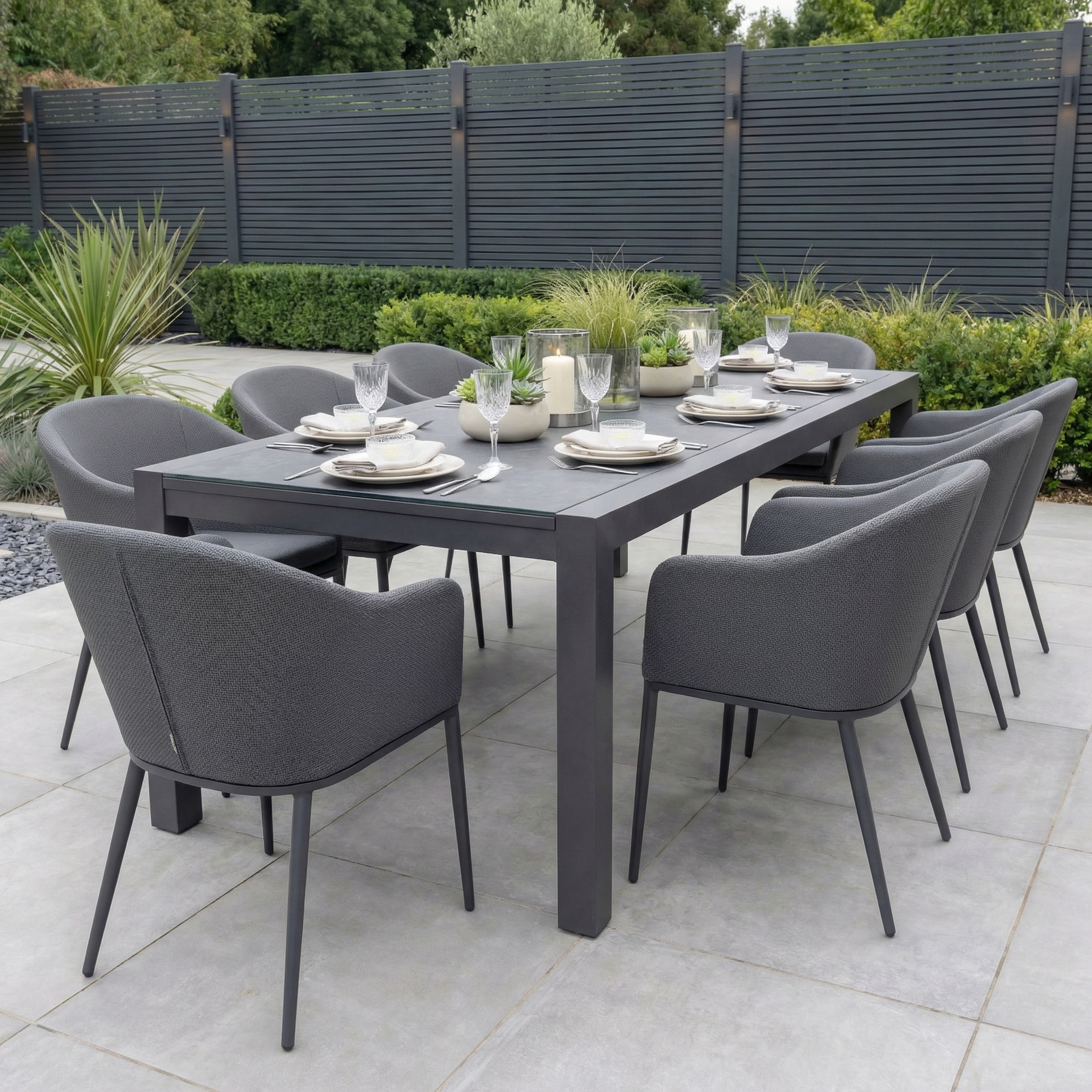 The Luna 8 Seat Outdoor Fabric Extending Ceramic Dining Set in Grey includes eight chairs and a ceramic table, offering stain-proof, stylish, and low-maintenance outdoor dining—perfect for entertaining on your patio.