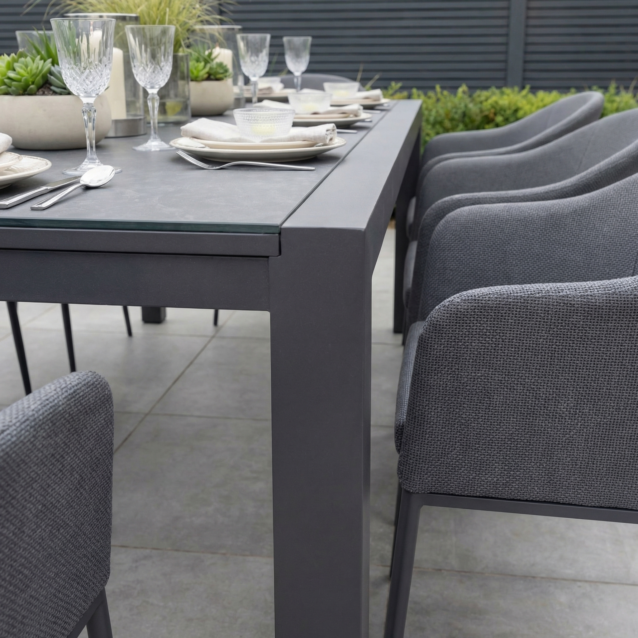 Elevate your patio with the Luna 8 Seat Outdoor Fabric Extending Ceramic Dining Set in Grey—modern, all-weather comfort perfect for stylish alfresco dining. Complete your look with coordinating chairs, glassware, plates, and planters.