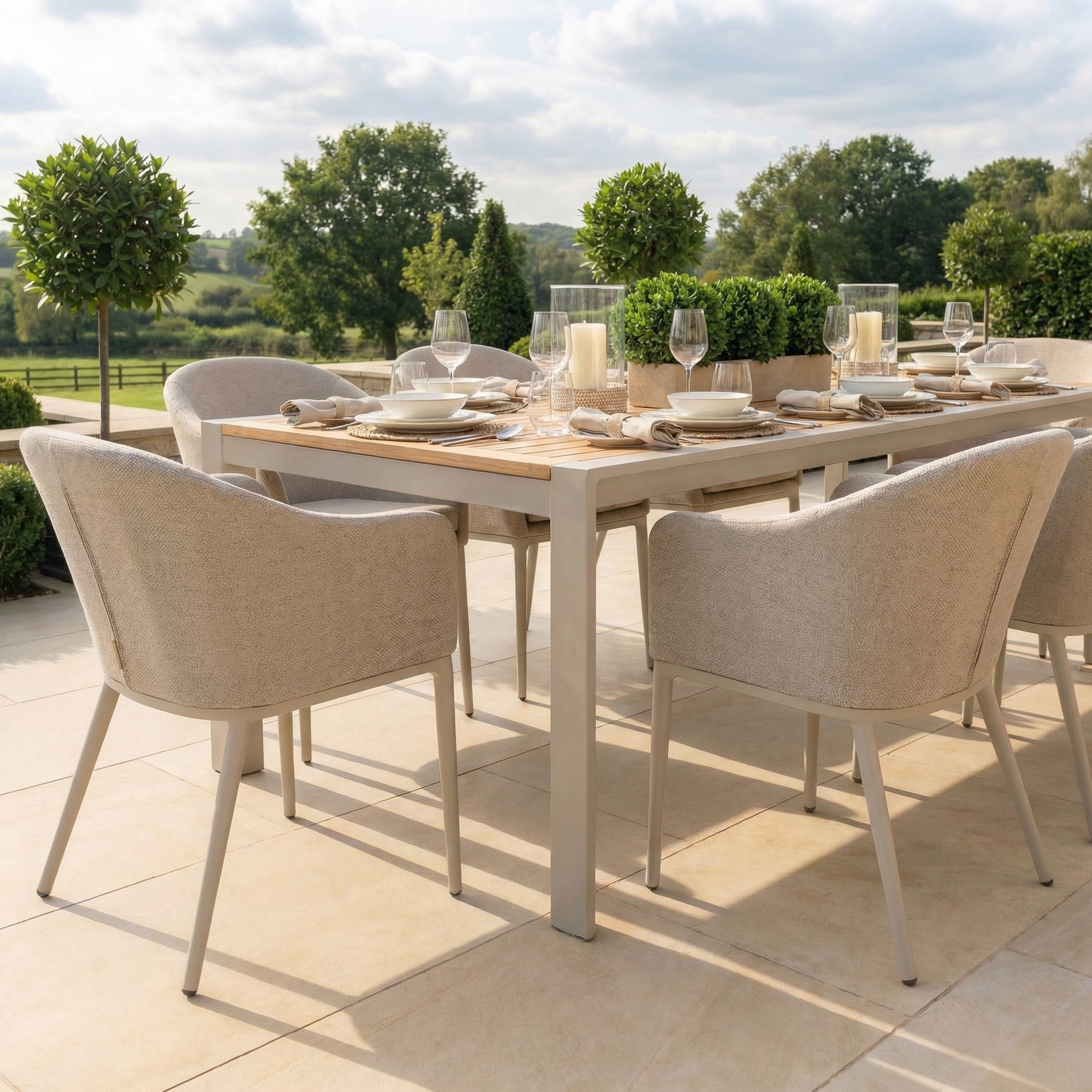 The Luna 8 Seat Outdoor Fabric Extending Teak Dining Set in Fawn features a sleek teak table and eight cushioned chairs, perfect for sunny garden patios.