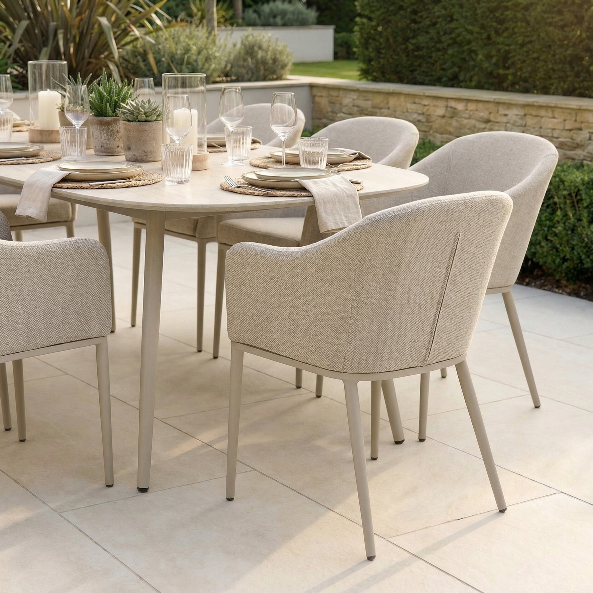 The Luna 8 Seat Outdoor Fabric Oval Ceramic Dining Set in Fawn features neutral tones, eight cushioned chairs, and a stain-resistant ceramic table—ideal for stylish dining on your patio.