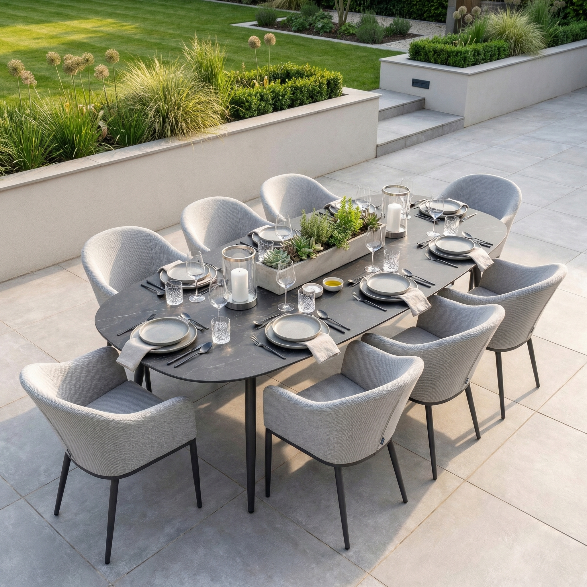 The Luna 8 Seat Outdoor Fabric Oval Ceramic Dining Set in Oyster Grey features gray chairs with Luna outdoor fabric and minimalist design, perfect for sunny patios and crafted from all-weather materials.