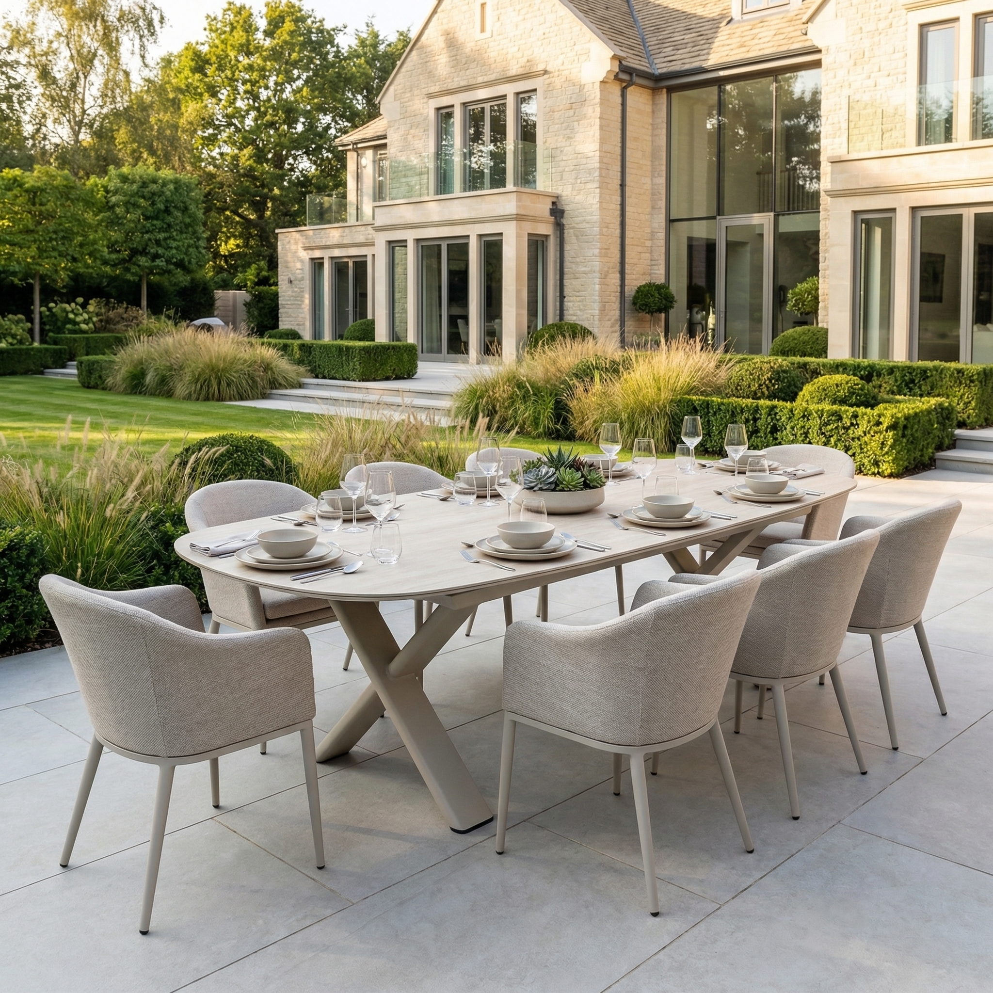 The Luna 8 Seat Outdoor Fabric Oval Dining Set with Albatross Extending Table in Fawn offers UV-resistant comfort for eight, perfect for patios and modern homes with landscaped gardens.