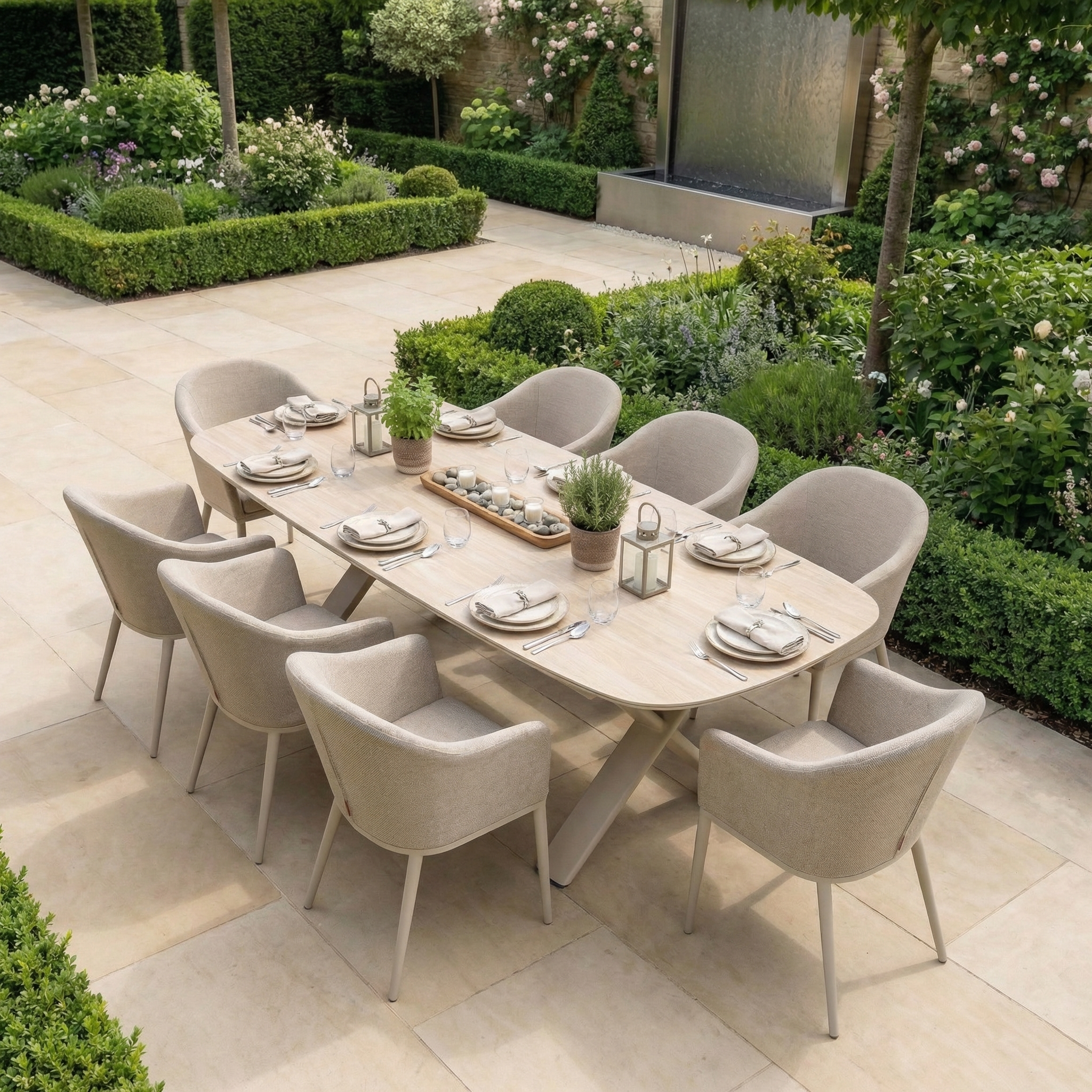 The Luna 8 Seat Outdoor Fabric Oval Dining Set with Albatross Extending Table in Fawn features UV-resistant beige chairs around a spacious extending table, ideal for comfortable outdoor dining in a lush garden setting.