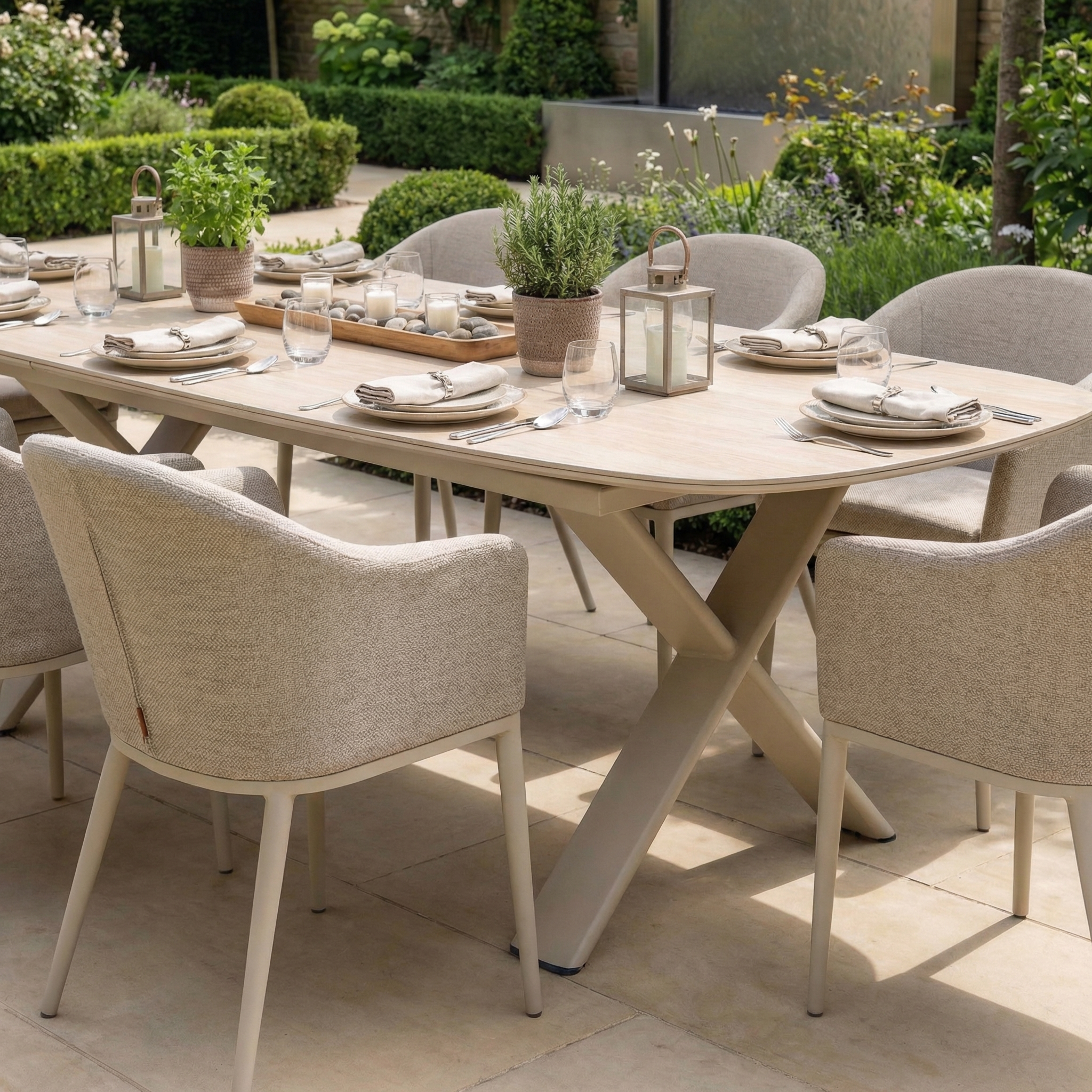 The Luna 8 Seat Outdoor Fabric Oval Dining Set with Albatross Extending Table in Fawn offers stylish, UV-resistant comfort for your patio, perfect for dining with friends and family outdoors.