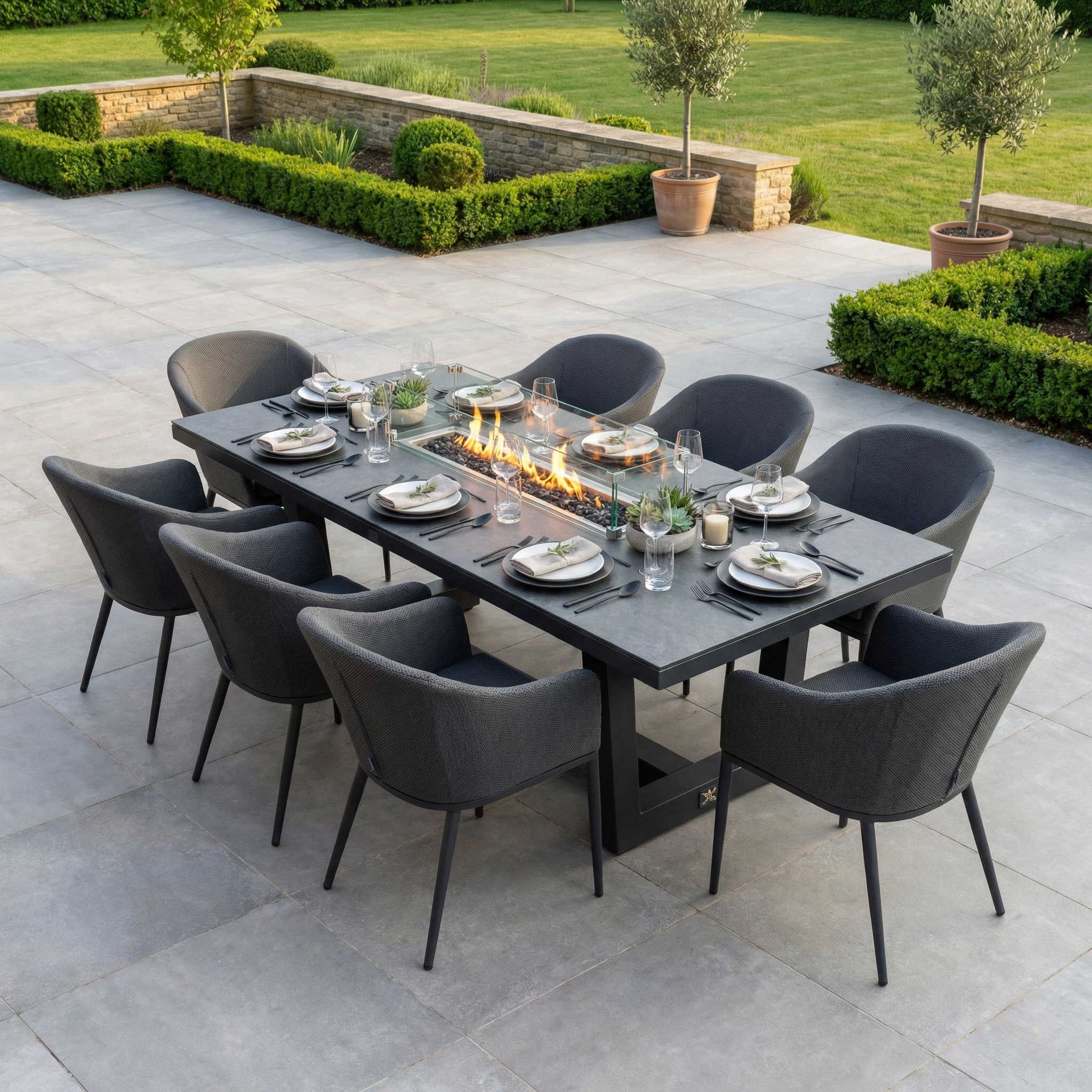 The Luna 8 Seat Outdoor Fabric Rectangular Ceramic Firepit Dining Set in Grey features a stylish firepit centerpiece and is made from durable, all-weather materials—perfect for modern outdoor dining with eight chairs.