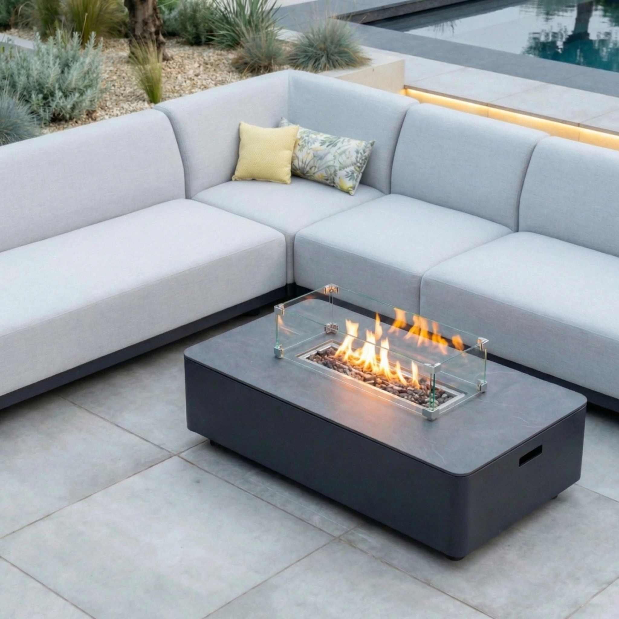 The Luna Outdoor Fabric Large Corner Group Set with Firepit Coffee Table in Oyster Grey offers a modern, stylish solution for outdoor spaces.