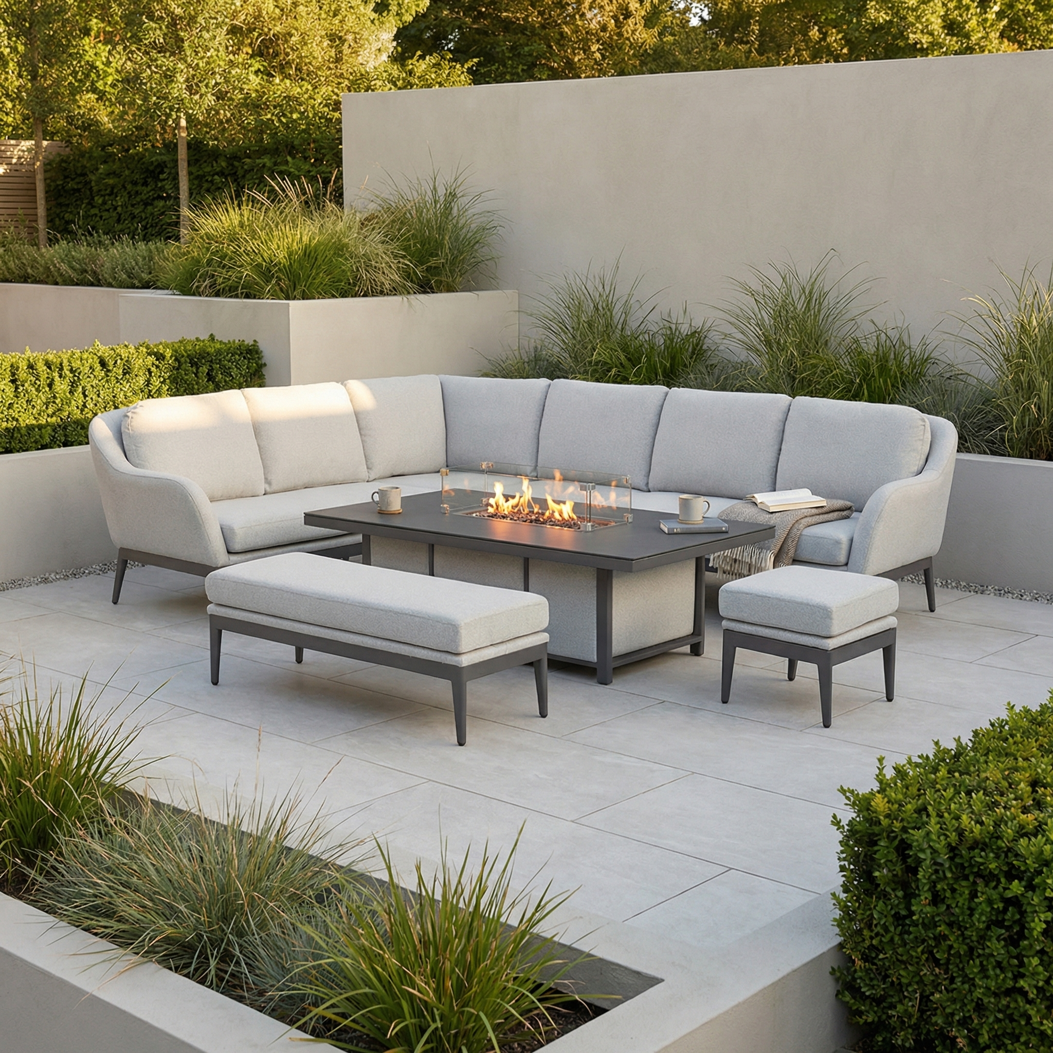 Enjoy effortless relaxation in a modern outdoor patio featuring the Luna Outdoor Fabric Rectangular Corner Dining Set with Rising Firepit Table in Oyster Grey (Left Hand), surrounded by low-maintenance garden furniture and lush greenery.