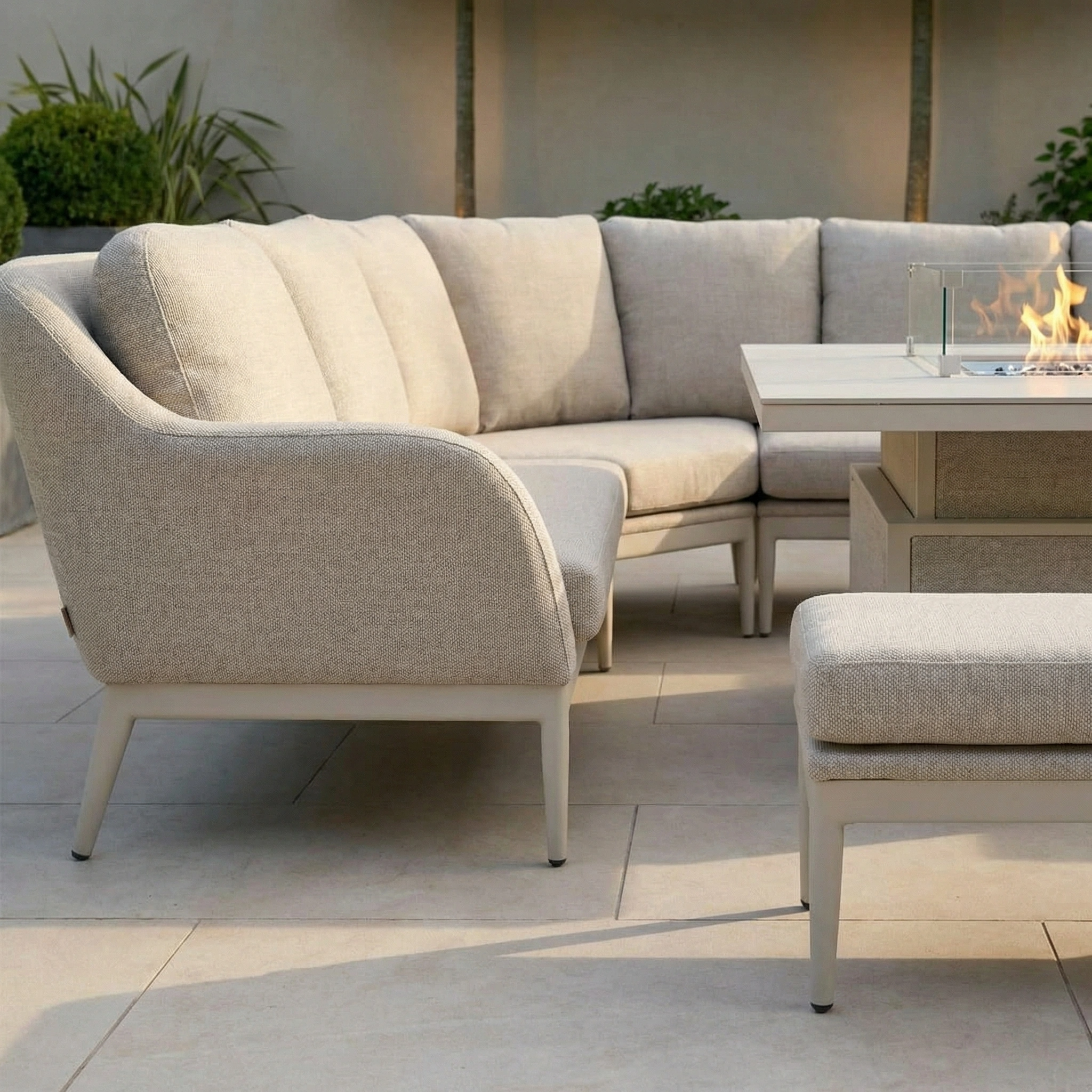 The Luna U-Shape Outdoor Fabric Corner Dining with Rising Table in Fawn brings a cozy, modern vibe to this tiled patio.
