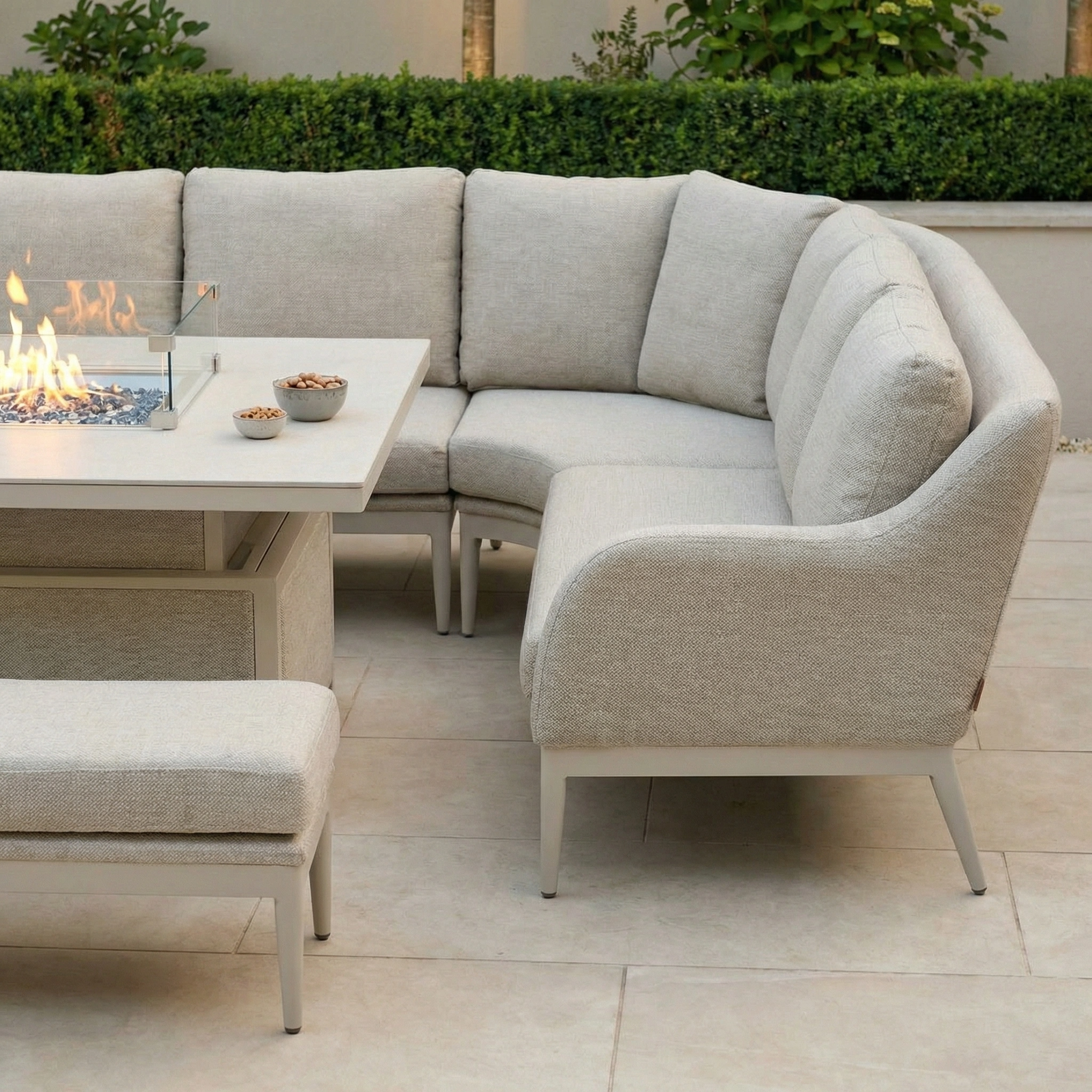 The Luna U-Shape Outdoor Fabric Corner Dining in Fawn features a rising table and spacious seating, ideal for stylish patio gatherings.