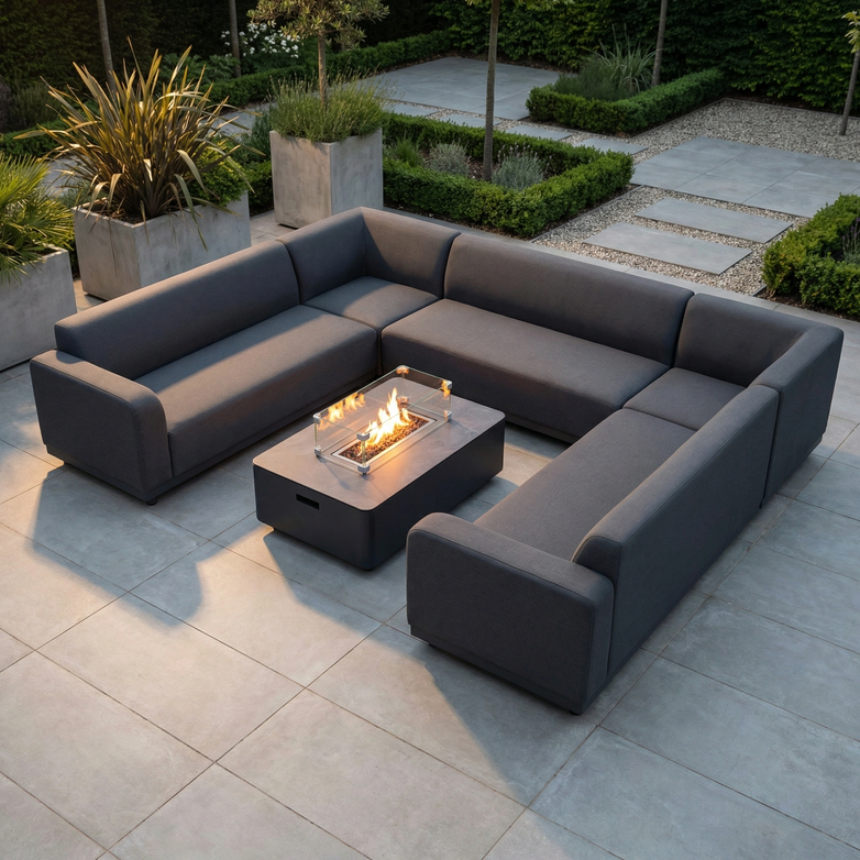 Modern patio featuring the Luna U-Shape Outdoor Fabric Sofa Set with Firepit Coffee Table in Grey, designed in all-weather fabric and set on large stone tiles.