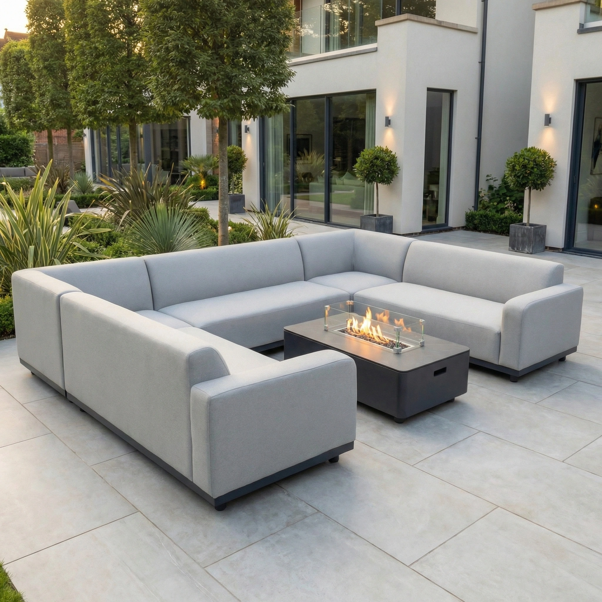 Modern outdoor patio featuring the Luna U-Shape Outdoor Fabric Sofa Set with Firepit Coffee Table in Oyster Grey on a tiled terrace.