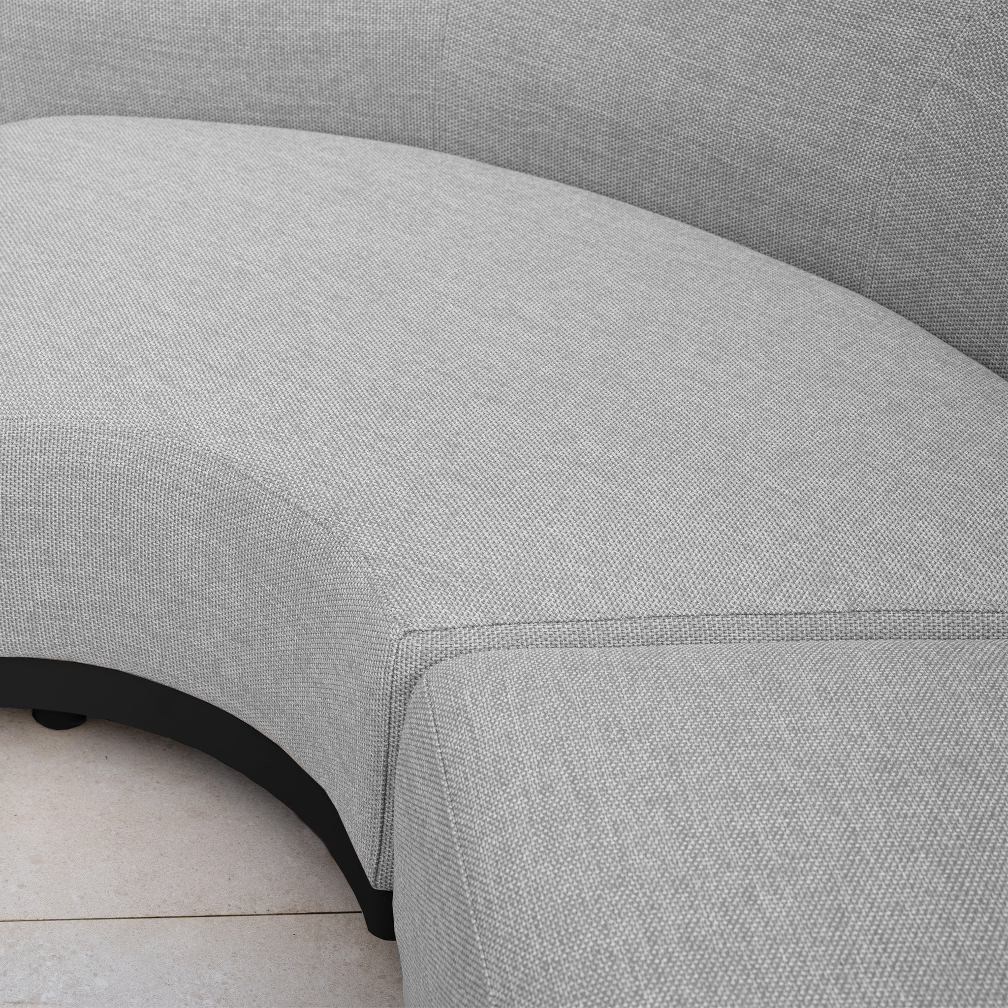 The Luna Outdoor Fabric Curved U-Shape Sofa Set with Altura Rising Table in Oyster Grey features solution-dyed acrylic upholstery—ideal for stylish, all-weather outdoor spaces on light tiled floors.