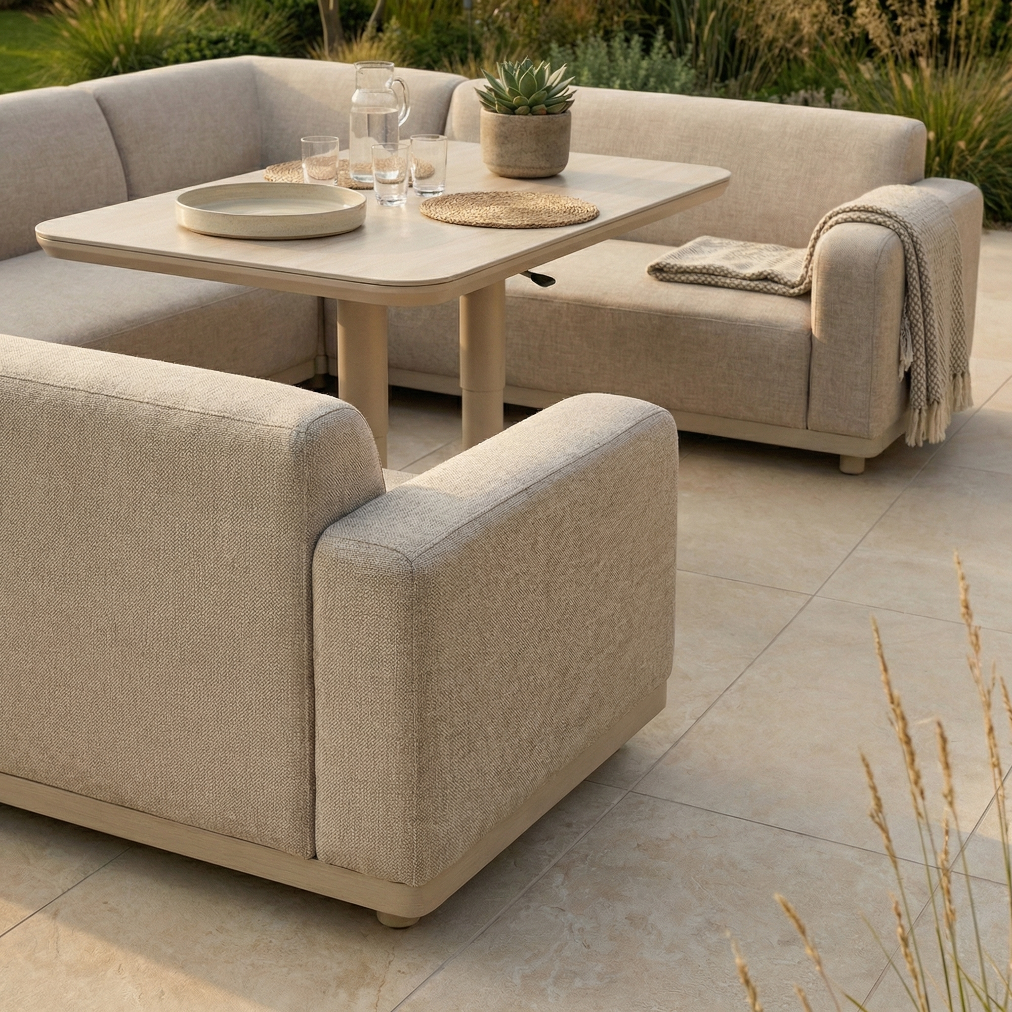 The Luna U-Shape Outdoor Fabric Sofa Set with Altura Rising Table in Fawn offers weather-resistant, stylish garden seating—perfect for outdoor living on a tiled patio. Includes sofa and hydraulic table for versatile entertaining.