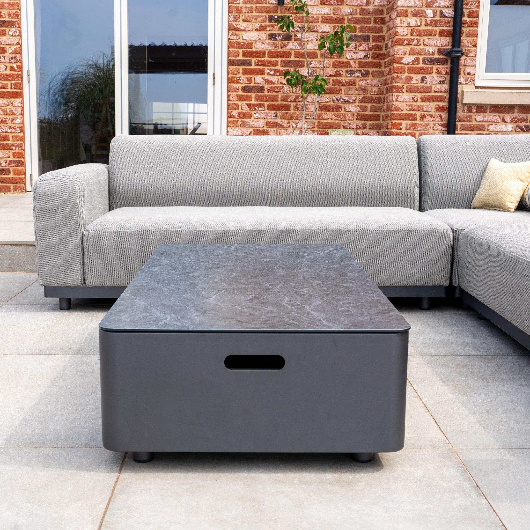 The Luna Outdoor Fabric Corner Sofa Set with Coffee Table in Oyster Grey offers lasting style and comfort with durable all-weather material, featuring a chic grey sofa and matching table—perfect for your patio or garden.