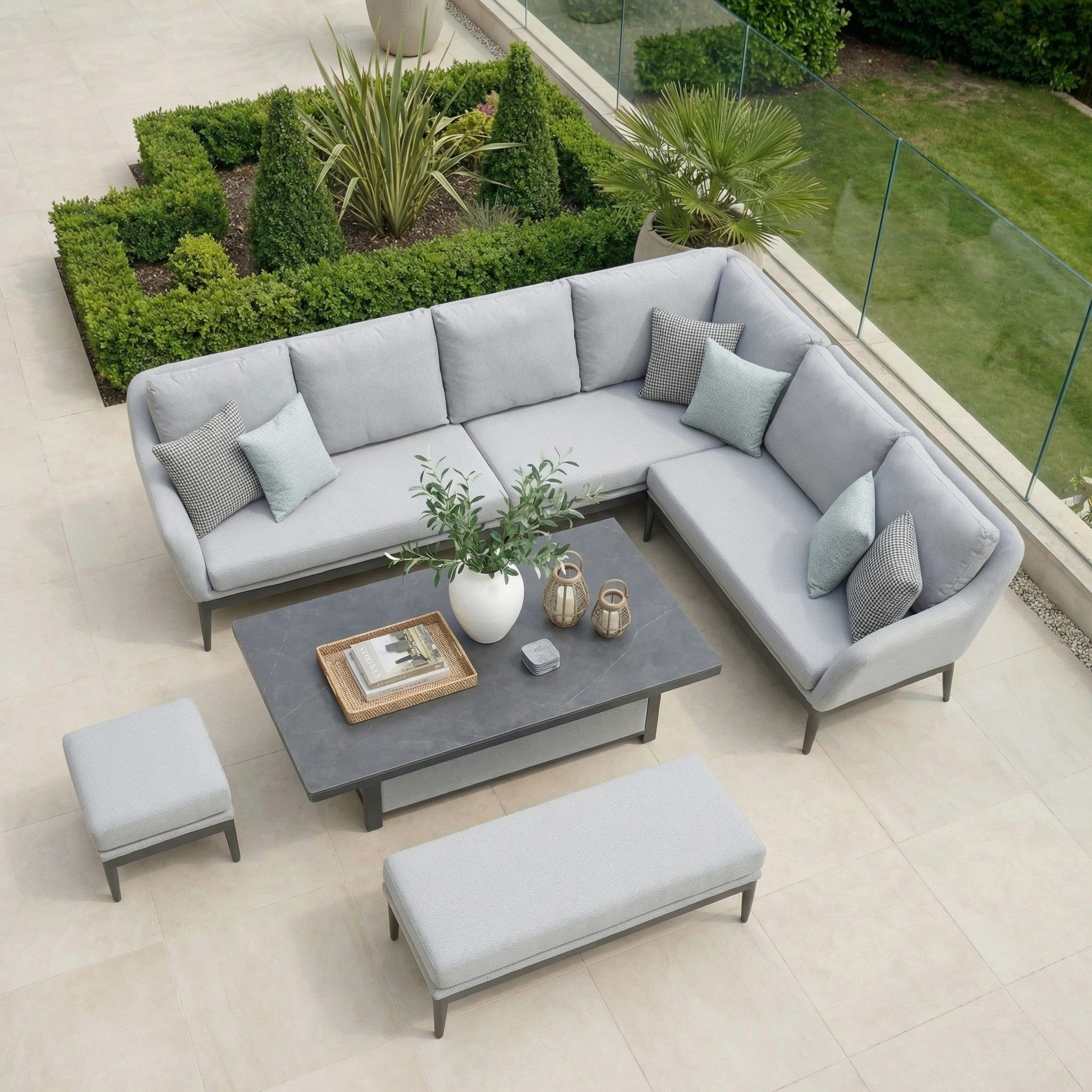 The Luna Outdoor Fabric Rectangular Corner Dining Set with Rising Table in Oyster Grey (Right Hand) features comfy cushions and chic style, perfect for outdoor dining with garden views.